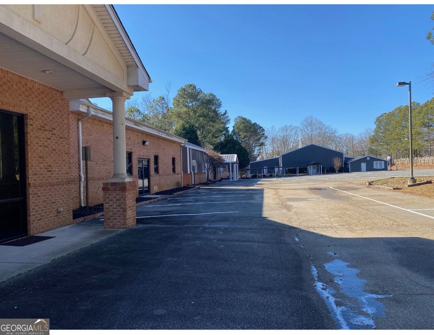 Prime Location of this 10,060-square foot brick building that was originally constructed to serve as a Youth Chapel and Educational Center. This building is part of a church complex off Holly Springs Road. Close in proximity to Sandy Plains Road, Shallowford, and Roswell Road. This is a mixed used building that has a chapel, band room, areas for day care space/kids room while worshipping. It has huge area for day care center at the end of the building. There are 11-12 office spaces that is perfect for other businesses. Owner is willing to split the building for church, day care center, and office spaces, subject to discussions. Owner reserve the right to sublease part of the the building for other usage. The overall usage can also be for youth recreation/leaning center, and a not profit organizations. Loads of potentials in this building, come see and expand your usage visualization. Another 1,392 sq ft office space is available to lease in the front of the building as well.