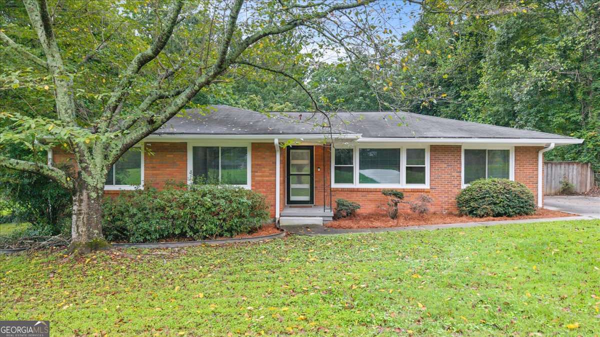 Nestled just outside the Perimeter in a prime Dunwoody location, 5124 Tilly Mill Road offers the perfect blend of modern convenience and suburban charm. Whether you're biking through the trails at Brook Run Park, exploring the weekend farmers market, or enjoying nearby restaurants and retail at Perimeter Mall, this home places you at the center of it all. Just minutes away, Brook Run Park features multi-use trails, a skate park, soccer and baseball fields, a dog park, outdoor theater, and even a community garden - making it one of the largest and most dynamic green spaces in the metro area. Step inside this fully renovated 4-bedroom, 2-bath brick ranch, thoughtfully updated for today's lifestyle. Gleaming floors flow throughout the entire home, complemented by fresh paint and modern finishes. The kitchen is both stylish and functional, featuring stone countertops, stainless steel appliances, a breakfast bar, and white cabinetry, with direct access to a light-filled dining area - perfect for casual meals or entertaining. The spacious living room offers a separate, quiet space to relax or gather, while a fourth bedroom currently styled as a home office provides great flexibility for remote work or creative pursuits. Outside, enjoy the large deck, grill-ready gazebo, and garden beds overlooking a massive 0.7-acre fenced backyard - a rare find offering space to entertain, garden, or simply relax. A storage shed provides extra functionality for tools, gear, or hobbies. With stepless living, updated systems, and unbeatable proximity to parks, retail, and major highways, this home checks all the boxes for comfort, flexibility, and location.