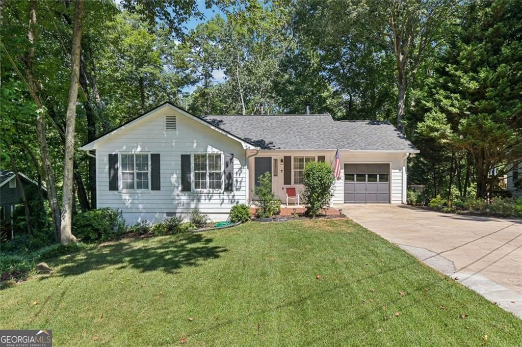 Fantastic Opportunity to be in the Sought After Lake Community of Shady Shores! This Wonderful 3BR/2 Bath Home has Been Remodeled and is in Move-In Condition! All the Heavy Lifting Has Been Done w/New Roof, New Windows, Hot Water Heater (4 Months Old) and HVAC (3 Years Old). Park Your Boat or RV on Your Property! Voluntary HOA Provides Private Gated Boat Access to Lake Lanier! Chef's Kitchen with Quartz Countertops, Stainless Steel Appliances, Built-in Microwave, Custom White Shaker Cabinets, Tiled Backsplash, Upgraded Fixtures and Vaulted Breakfast Area with Chandelier. Spacious Vaulted Family Room with Wonderful Wood Burning Stone Fireplace and Ceiling Fan. Gorgeous New Floors Throughout! Master Suite w/Ceiling Fan and Walk-in Closet. Updated Master Spa w/Tiled Floor, and Custom Vanity . Two Secondary Bedrooms w/Ceiling Fans and Renovated Secondary Bath w/Tiled Floor, Updated Vanity and Light Fixtures. Fantastic Oversized Deck Overlooks Private Backyard and is Great for Entertaining and Relaxing. Walk Down to the Baldridge Creek and Kayak Down to the Lake!!!! New Roof and Windows Throughout!