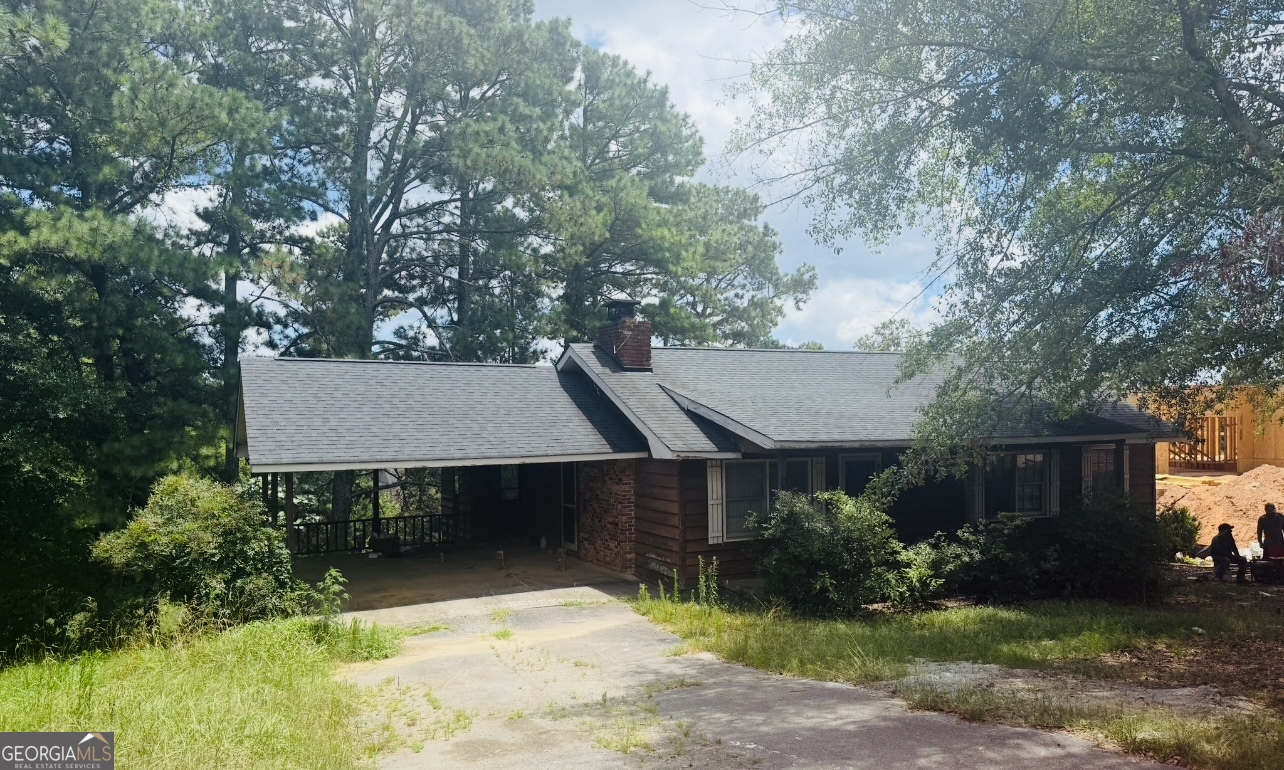 Rare Opportunity in Buford City Schools ? No HOA & Ideal for Redevelopment! Welcome to 3273 N Bogan Rd, a charming 3-bedroom, 2-bathroom single-family home nestled on a beautifully secluded 0.724-acre lot in the highly sought-after Buford City School District. Built in 1975 and offering 1,306 square feet of living space, this home presents endless potential. Whether you're looking to renovate, expand, or redevelop the property altogether. Surrounded by mature trees and tucked away from the road, the lot offers the perfect blend of privacy and convenience. Located just minutes from the Mall of Georgia, Lake Lanier, parks, dining, and with easy access to major interstates, this location is unbeatable. With no HOA restrictions, the possibilities are wide open. whether you're a homeowner, builder, or investor looking for your next project in one of Gwinnett County's most desirable areas. Don't miss this incredible opportunity to own a spacious lot with development potential in the heart of Buford!
