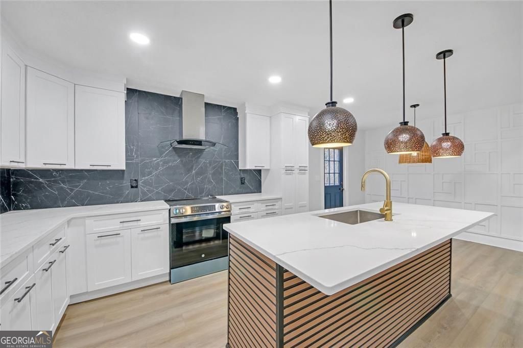 Beautifully Renovated 3-Bedroom Home, LOCATED approximately 1 MILE from Downtown Woodstock with Finished Basement, Designer Upgrades & NO HOA. Welcome to this beautiful home, where modern elegance meets comfort on a quiet cul-de-sac. Step onto the expansive new front deck and enter the inviting great room, featuring a cathedral-beamed ceiling and an open layout that seamlessly connects to the bright, newly designed kitchen. The kitchen is a chef's dream, boasting new white cabinetry, quartz countertops, a stylish backsplash, a large island, and an eat-in dining area with access to the spacious back deck overlooking the backyard -perfect for gatherings and entertaining. Thoughtful upgrades throughout include custom wall trim and new wood flooring, adding warmth and character to the home. The primary suite offers a finished walk-in closet and a spa-like en-suite bathroom with dual vanities and a walk-in shower with dual shower heads. Two additional spacious bedrooms share a newly updated bathroom featuring double vanities and a quartz shower/tub combo. The finished basement provides extra living space, including a large family room and an additional room with a closet, ideal for a home office, gym, or guest quarters. Easy access to the two car garage with extra storage. Many upgrades include new roof, windows, front deck with supports, flooring, light fixtures and more. This move-in-ready home is a must-see-schedule your showing today!