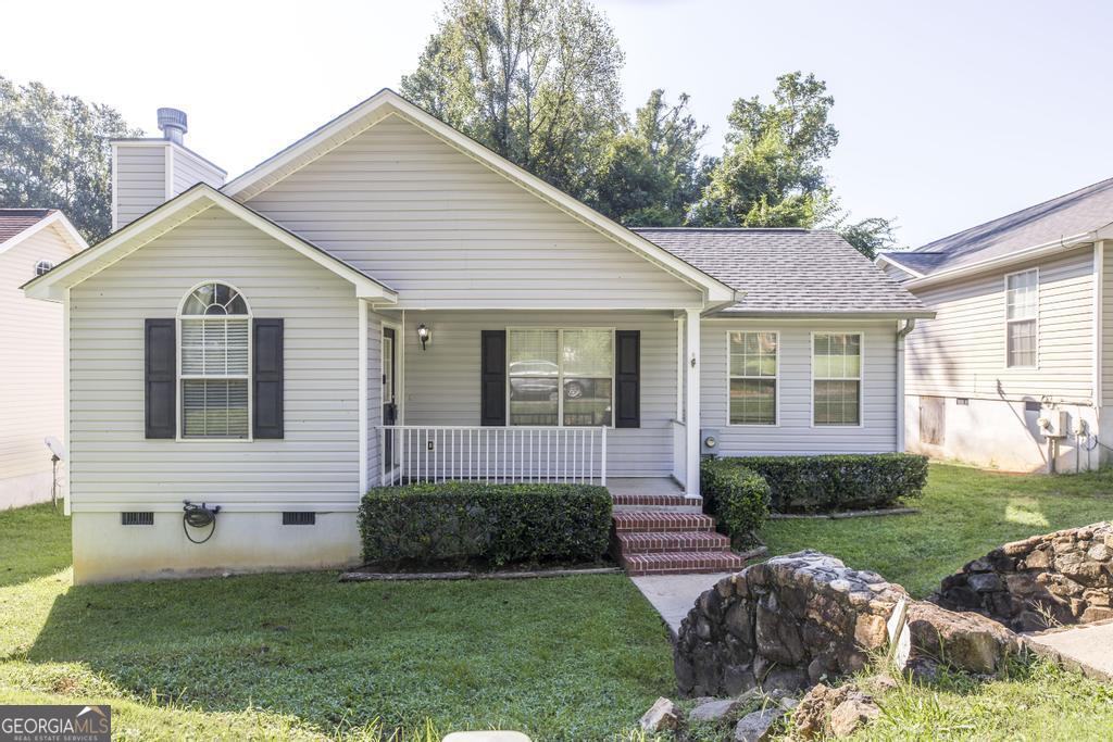 Cute at a button! Great home for the first time home buyer or investor. Walk in to coziness and comfort. Nestled off of Nottingham Dr., this home boasts a great floor plan, with three bedrooms and 2 baths, one car garage, large kitchen and separate dining and living rooms. Rocking chair front porch, and back private entry for only those that live on the street. Great location for anyone needing a quick trip to downtown, grocery store, hospital, doctors and more! Come take a look at this home today.