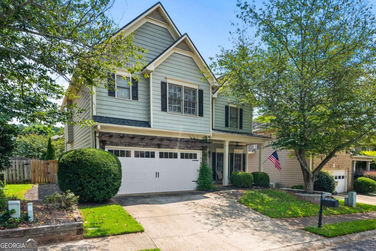 Updated home in desirable Mirramont community. This open concept home features an updated kitchen with quartz countertops, marble backsplash, new hardware, faucet, and newer stainless steel appliances. The kitchen overlooks two-story great room with tons of natural light and gas fireplace. Custom walk-in butler's pantry adds a ton of storage and function. Upstairs you will find two guest rooms, an updated full bath, updated laundry room with tons of storage and a primary en suite. The generously sized primary features tray ceilings and a custom sliding door to the updated en suite bathroom with double vanities, separate tub/shower, and entrance to the large walk-in closet. Flat level backyard with recently stained wood privacy fence and new Bermuda sod laid in 2022. This home has so many updates and improvements including, living room beams, new interior paint, tiled floors in kitchen and back hall, new garage door opener, updated kitchen and baths, custom millwork including shiplap and board and batten feature walls, new fixtures throughout, additional pea gravel dining space out back, and the list goes on. With Great Cherokee County schools, and close to shopping, restaurants, lake, hospitals and medical services, I 575 express lanes and a short drive to Downtown Woodstock.