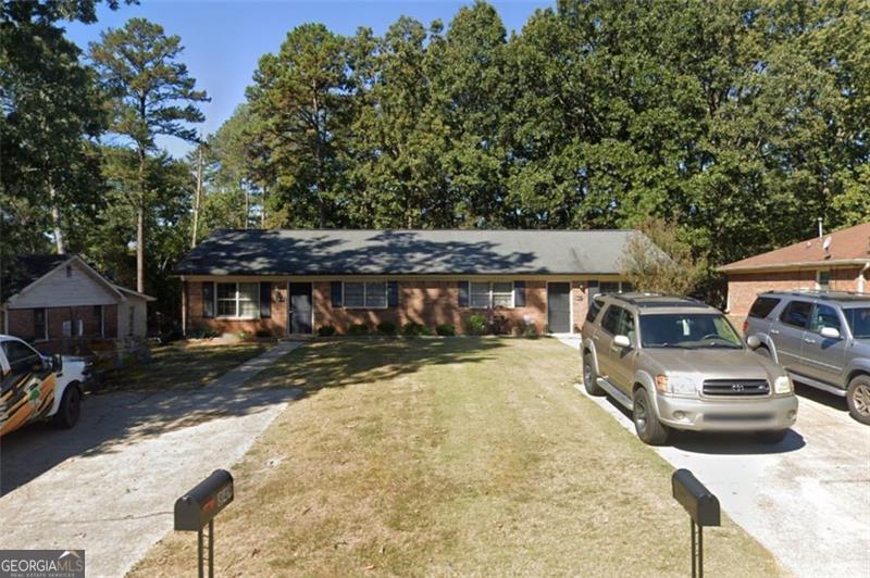Duplex Opportunity in Prime Lawrenceville Location! Perfectly positioned just minutes from The Shoppes at Webb Gin and all the dining and retail Scenic Hwy has to offer. This all-brick duplex is a rare find. Each unit features 2 spacious bedrooms and 1 full bathroom, including private primary suites and generously sized secondary bedrooms. The bright, open floor plans offer large living rooms ideal for entertaining, plus kitchens with ample cabinet space. Step out onto the back decks and enjoy the peaceful backyard setting. Whether you're looking to live on one side and rent the other, house multiple generations, or add a solid income-producing asset to your portfolio, this property checks all the boxes! Don't miss this rare opportunity to own a duplex in a thriving, high-demand area of Lawrenceville! Contact Rae Johnson with eXp Realty for additional information.