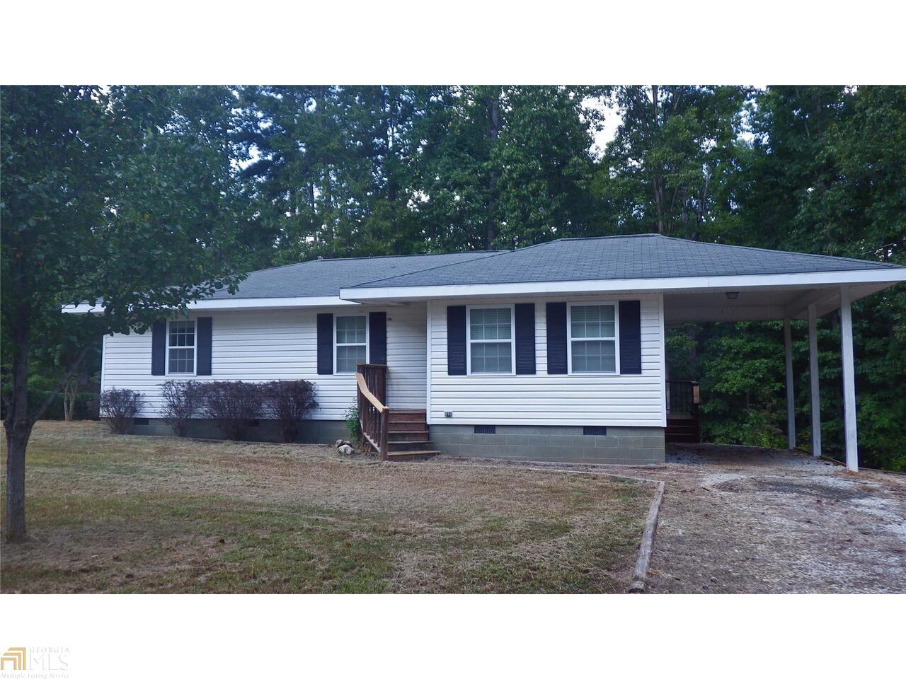 Perfect home for so may lifestyles! This almost on the lake home is perfect for easy on the lake access. Lake is just around the corner with boat ramp,fishing,walking trails and picnicing! Looking for retirement opportunities or needing a place for that student at the technical college? Home is completely updated with redone hardwood floors, kitchen is completely renovated, separate pantry and laundry closet. Private back yard would work for boat storage or garden. Seller says to offer owner financing with down payment. Cheaper than rent! Seller will provide termite bond!