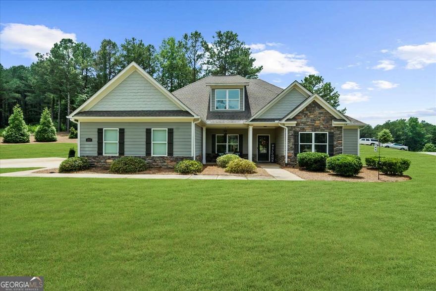 The one you've been waiting for just hit the market and yes, it's even better in person!! Impeccably maintained ranch floorplan in the heart of Monroe! Beautifully maintained home in pristine condition with the perfect blend of modern style and comfort. The location is ideal, just a short drive from the charming area of downtown Monroe with its local shops and eateries. It's convenience to Athens is perfect for attending UGA events and enjoying the vibrant college town atmosphere. Situated on a gorgeous 1.1+/- acre corner lot, this property provides plenty of outdoor space plus a full yard sprinkler system. The open-concept design offers a pleasant space for both every day living, family gatherings, and entertaining. With the master suite + three additional bedrooms and three full bathrooms (including one equipped with a shower designed for enhanced accessibility) on the main living level, there is plenty of space for everyone. The possibilities are endless with the generously sized bonus/flex room and en-suite full bathroom you'll find upstairs. Office space, Man Cave, Additional bedroom, Playroom, Craft Room, etc. can all be accomplished with this space! Don't miss your chance to own this exceptional property that truly checks every box. Schedule your private showing today!!