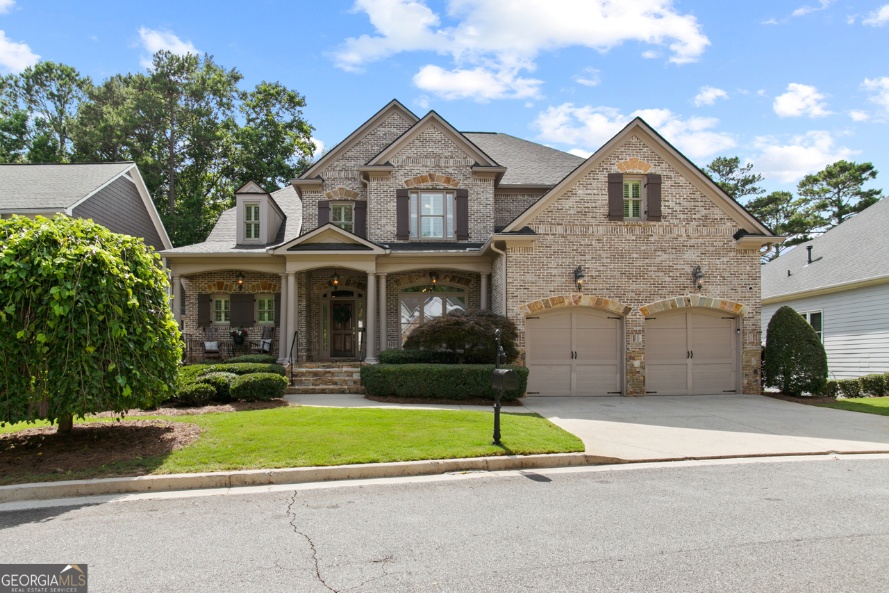 Welcome to 1701 Tipton Court in Brookstone Commons-where luxury meets lifestyle in the heart of Acworth! This exquisite four-sided brick home is filled with high-end finishes and thoughtful upgrades throughout, offering the perfect blend of elegance, comfort, and functionality. From the moment you step inside, you'll be greeted by freshly refinished hardwood floors, brand-new carpet, and fresh interior paint-making this home truly move-in ready. The main-level primary suite is a peaceful retreat, featuring a tray ceiling with custom track lighting and private access to the back deck. The luxurious primary bathroom boasts an oversized, two-person cast iron tub, double vanities, and a walk-in shower with a 7-head "vertical spa" system. A custom-designed closet with built-ins maximizes organization and storage. An additional bedroom and full bath on the main level offer flexibility-ideal for guests, a home office, or multigenerational living. The formal dining room features a tray ceiling and oversized windows, creating a bright and welcoming space. The two-story family room impresses with a stone fireplace, custom built-ins, and expansive windows that frame serene views of the Brookstone Golf Course. And now, the true showstopper: the gourmet kitchen and keeping room. This thoughtfully designed kitchen features custom cabinetry with built-in organizational extras, under-cabinet lighting, granite countertops, a center island, and a breakfast bar. It opens directly to the cozy keeping room, where you'll enjoy panoramic views of the sixth fairway-a perfect backdrop for everyday living or entertaining. Upstairs, you'll find three generously sized bedrooms, each with large, custom closets, and two well-appointed bathrooms. The walk-out unfinished basement is already plumbed for a bath and offers endless potential for customization-or abundant storage space as-is. Additional highlights include a like-new central vacuum system, built-in speaker system, Ring doorbell, a fully transferable home warranty, and termite bond for added peace of mind. The front and side yards are professionally maintained by the HOA, and residents have the option to join the nearby Brookstone Golf & Country Club. Perfectly located near shopping, dining, and top West Cobb amenities, this is a rare opportunity to own a truly show-stopping home with golf course views in a sought-after community.