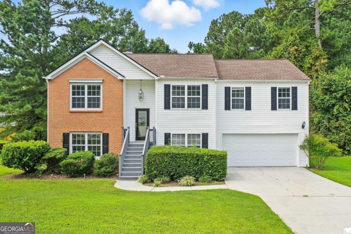 Welcome to Your New Chapter in Breckinridge Club! Step into this beautifully maintained 4-bedroom, 3-bathroom split-foyer home in the sought-after Breckinridge Club subdivision of Loganville. With fresh interior paint and a spacious open-concept layout, this home offers the perfect blend of comfort and style for everyday living and entertaining. Upstairs, you'll find generous living and dining spaces filled with natural light, along with well-sized bedrooms that provide everyone their own retreat. The lower level features an additional bedroom and full bath-perfect for guests, a teen suite, or a private home office. Enjoy a nice-sized, level backyard ideal for weekend barbecues, playtime, or simply unwinding after a long day. The home sits in a well-maintained, quiet community where pride of ownership is evident throughout the neighborhood. Whether you're upsizing, downsizing, or relocating, this move-in ready home offers the lifestyle you've been looking for-convenient, comfortable, and close to everything Loganville has to offer. Preferred lender, Don Thelen, with Guaranteed Rate Affinity, will offer up to $2,500 in lender credit for closing costs, pre-paids, escrows or home warranty with approved offer. Conditions apply.