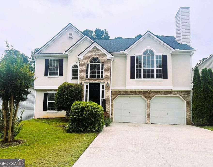 Welcome to this beautifully maintained, multi-split level home, located in a prime Marietta location! This spacious 4-bedroom, 3-bathroom home offers a fantastic blend of comfort, style, and convenience.  Freshly painted and meticulously cared for, this home features a modern, open-concept living space, with vaulted ceilings and stunning hardwood floors throughout, creating an inviting and spacious atmosphere.   The chef's kitchen is a true standout, featuring stainless steel appliances, ample cabinet space, and granite countertops. The adjoining dining area is perfect for family meals or dinner parties.  The spacious bonus room in lower level offers endless possibilities, whether it's a home theater, office, playroom, or even an additional bedroom. There's also a convenient storage/flex room in the garage, with direct access to the large, fenced backyard. Transform this space into your own home gym or workshop!  The backyard is an absolute retreat, offering plenty of space for children to play on the included playset, or for adults to unwind around the cozy firepit, this backyard is sure to impress.  This home also comes with major updates, including a newer roof (replaced in 2022), ensuring peace of mind for years to come.  Conveniently located just minutes from I-75 and I-285, you'll have quick access to The Battery, Marietta Square, dining, shopping, major hospitals and entertainment. Plus, enjoy the added benefit of grocery shopping right next door to the community!  This home offers the perfect combination of comfort, location, and value. Don't miss the opportunity to make it yours!