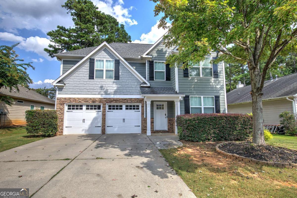 Beautiful Home in Wingfoot Park - Cartersville City Schools! Welcome to 155 Mercer Lane, nestled in the desirable Wingfoot Park subdivision and zoned for the highly sought-after Cartersville City School District. This spacious home offers 4 bedrooms, 2.5 bathrooms, and plenty of room to gather and entertain. Inside, you'll find a large separate dining room, perfect for hosting family and friends. The open-concept kitchen and living room create a warm, inviting atmosphere. The kitchen is a true highlight with stained cabinets, tile backsplash, granite countertops, and stainless-steel appliances. Major systems have been well maintained with a 1-year-old HVAC, 2-year-old water heater, and a 7-year-old roof, giving you peace of mind. Located within Cartersville city limits, you'll enjoy the convenience of being close to parks, restaurants, shopping, and more.