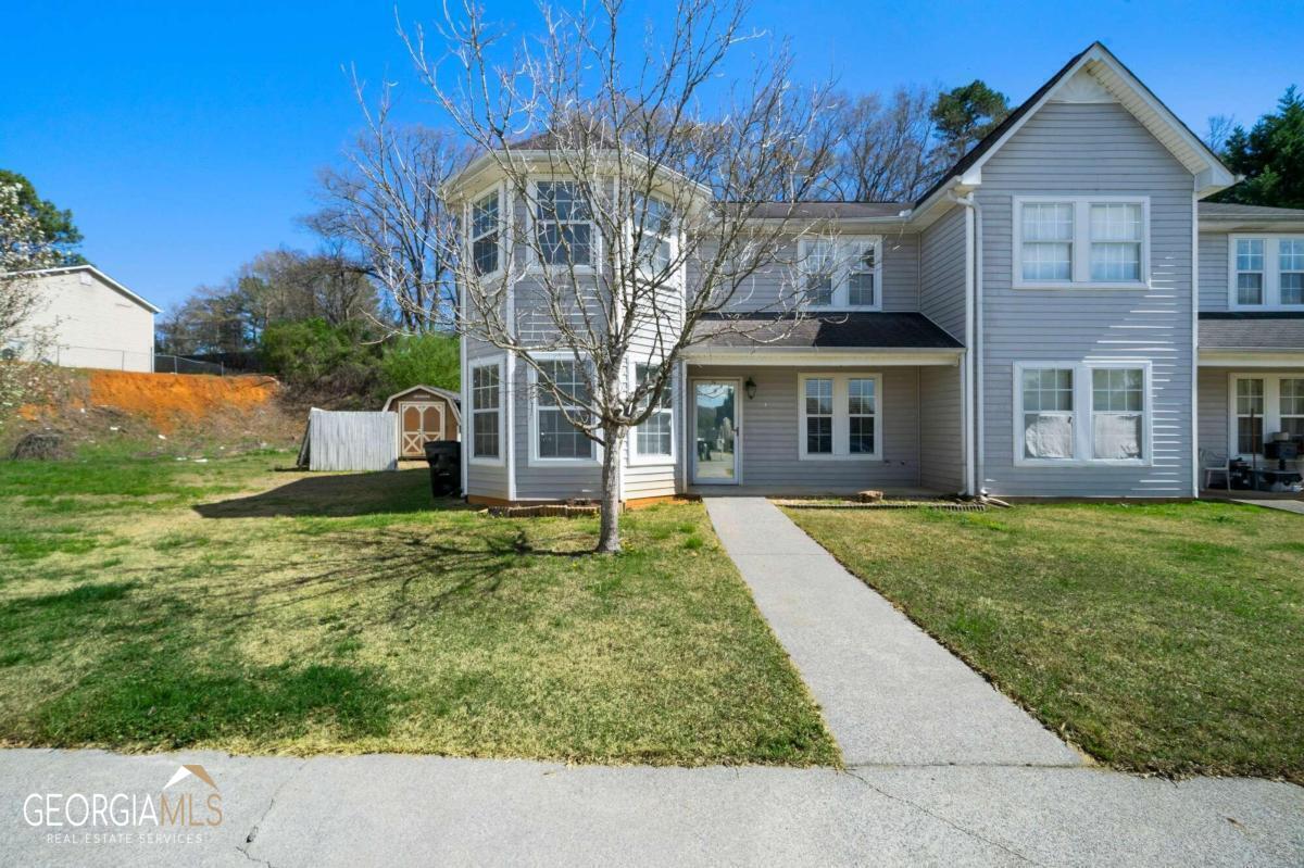 Great townhome near shopping, schools & restaurants! Open floor plan on main level boasts kitchen, dining areas with living room & half bathroom. Upstairs are the two bedrooms with two full bathrooms. Master bedroom is oversized and has two master closets! Backyard has covered patio area, is fenced & has an outbuilding for additional storage. Vacant & ready for make yours!