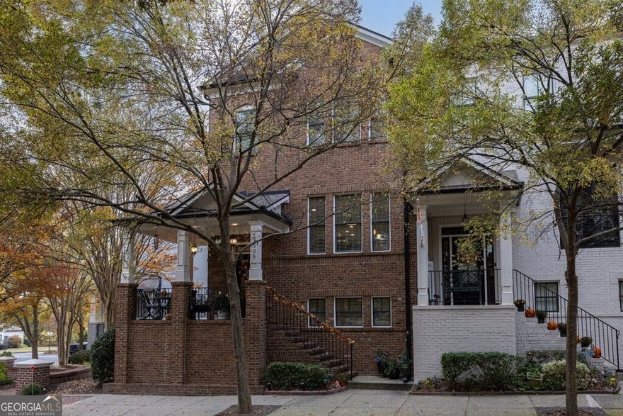 Move-in ready townhome - priced $18,500 below last sale! Priced to sell and perfectly located this beautifully updated townhome offers the best of modern living in the heart of downtown Suwanee. Step inside to an open-concept floor plan featuring a chef's kitchen with elegant quartzite countertops, classic white subway tile backsplash, double ovens, microwave, and a five-burner gas cooktop with stainless steel hood. The extra-large center island provides abundant prep space and seating, while the new wine/coffee bar with beverage fridge adds a perfect touch for entertaining or relaxing mornings. Enjoy beautiful wood floors throughout the main level and a spacious living area with a cozy fireplace. Extend your living space outdoors with a front covered patio overlooking the park--ideal for watching the sunrise with your morning coffee--and a large deck off the living area with plenty of room for dining, lounging, and grilling. The home has a total of three bedrooms and three and a half bathrooms, offering comfort and flexibility for family, guests, or a home office. Located in a highly desirable community, you're just steps away from restaurants, shopping, and entertainment and minutes from the Suwanee Greenway, Delray Nature Park, Play Town Suwanee, and Town Center on Main Park. Experience the perfect balance of vibrant city living and peaceful surroundings--all from your new home!