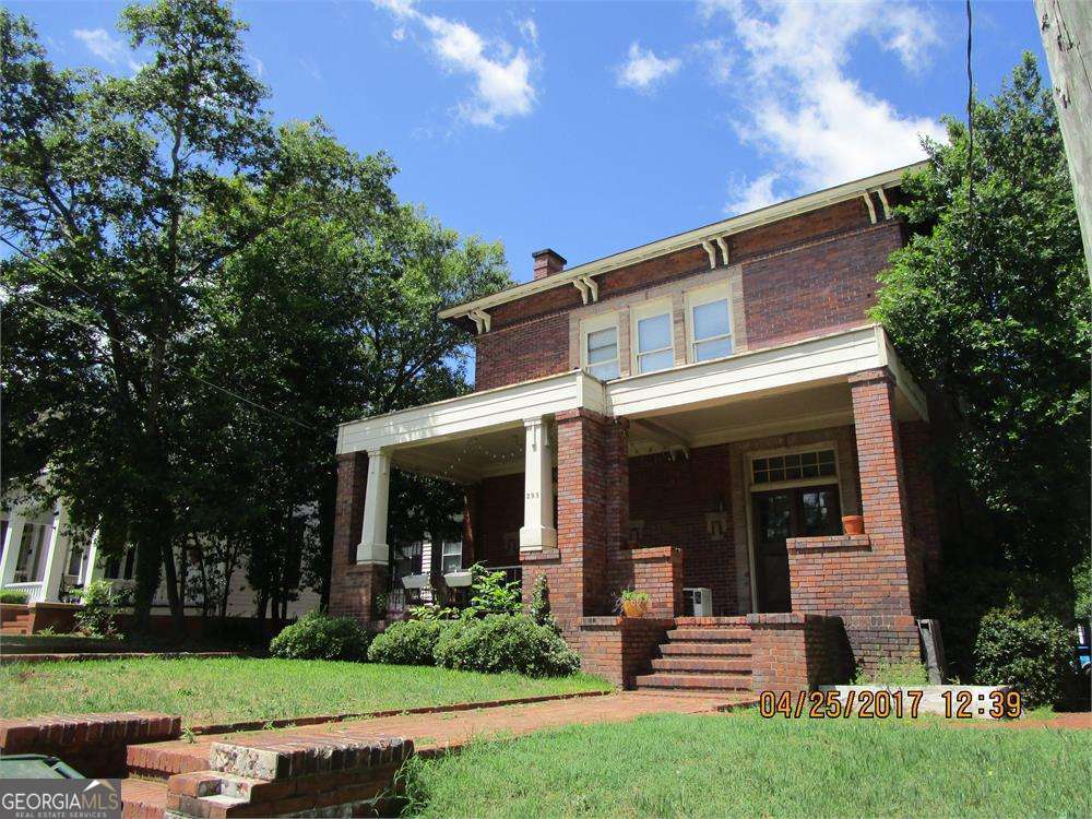 Historic Multi-Family Investment Property Across from Mercer University - Macon, GA Step into history with this stunning all-brick, two-story multi-family property, proudly listed with the Macon Historical Society and originally built in the mid-1800s. Thoughtfully renovated and move-in ready, this unique investment opportunity features four spacious units-two on the main floor and two upstairs-each offering 2 bedrooms, 1 bathroom each, and charming period details blended with modern updates. Inside, tenants will enjoy open kitchen floor plans with striking brick archway accents, abundant natural light, and access to a private balcony-perfect for morning coffee or evening relaxation. Each unit has its own electric and gas meter, allowing for separate utility billing. Adding even more value, the property includes a rare carriage house (ADU), original to the estate, with a full kitchen and living room downstairs, plus a bedroom and bath upstairs. With just minor finishing work, this space could serve as an additional rental unit, guest house, or private retreat. Located directly across from prestigious Mercer University, and minutes from the vibrant energy of Downtown Macon, this property is perfectly positioned to attract students, young professionals, and families. The area continues to grow with exciting new businesses, dining, and cultural attractions. Income Potential: * Typical rental rates: $800-$900/month per unit (with room for higher returns) * Four renovated, ready-to-rent units + 1 BR carriage house ADU * Strong rental demand from Mercer University and the thriving downtown scene Whether you're expanding your portfolio or seeking a distinctive investment with long-term growth potential, this historic property offers unmatched charm, prime location, and excellent income possibilities. There are no disclosures and no proforma. Please text the agent do not use showing time there are special showing instructions 404-557-7470
