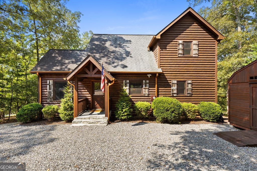 Tucked away in the heart of Blue Ridge's natural beauty, 4 Shalom offers a private mountain retreat in a sought-after gated community. Set on a serene lot with paved roads from start to finish-perfect for motorcycles and mountain cruisers-this home blends comfort, convenience, and adventure. Inside, you'll find three bedrooms thoughtfully arranged on separate levels, giving everyone their own private space. The kitchen has been updated with striking new granite countertops and freshly painted cabinets, while all major appliances remain under warranty until spring 2026-adding confidence and value for the next owner. Downstairs, new plush carpeting creates a warm, inviting feel in the game room and bedroom, ideal for cozy nights or family fun. Practical features include a small garage for motorcycles, ATVs, or mountain toys, plus an RV parking pad with accessible power. Offered fully furnished, this home is truly turn-key, making it an excellent short-term rental investment or personal mountain escape. Beyond the home itself, residents enjoy a private community common area along the sparkling Toccoa River-perfect for fishing, tubing, or simply relaxing by the water. And just minutes away, the charming town of Blue Ridge awaits with its award-winning wineries, craft breweries, and gourmet restaurants, offering a perfect balance of rustic adventure and refined indulgence. Whether you're seeking a private getaway, an income-producing property, or a home base for endless North Georgia adventures, 4 Shalom delivers a lifestyle where mountain living meets modern comfort.