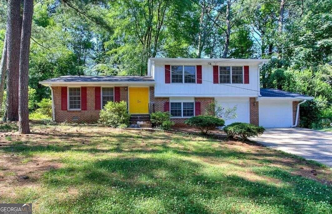 This beautiful split-level home is located at Hambrick Downs, stone Mountain. It is 3 bedroom hardwood flooring.The attached garage with enough storage space & large drive. The private front and back yards are level. This home is a clean slate needed slightly finishing touches. The roof is new , newly painted house, new HVAC system, new flooring, and new appliances. The house is in very convenient locations for shopping, restaurants, entertainment, all major highways nearby and more. Please Don't miss this beautiful home!