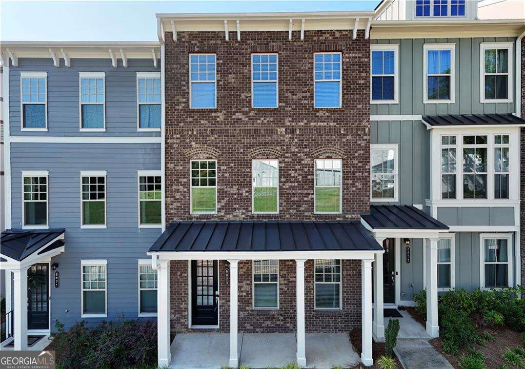 Experience Refined Living in the Heart of Norcross. Welcome to your elegant new townhome, where timeless charm meets modern luxury. Perfectly situated just a short stroll from the vibrant Historic Downtown Norcross and offering seamless access to I-85 via Jimmy Carter Blvd, this brand-new residence blends convenience with sophisticated design. Thoughtfully crafted with comfort and style in mind, this expansive home features 4 generously sized bedrooms, 3.5 spa-inspired bathrooms, and a 2-car garage, ideal for both everyday living and entertaining. The terrace level offers a private guest suite with its own full bath, creating the perfect retreat for visitors, in-laws, or a quiet home office. On the main level, you'll find an open and inviting layout centered around a warm fireplace in the family room, flowing effortlessly into a designer kitchen adorned with granite countertops, stainless steel appliances, and ample cabinetry. The adjacent dining area opens to a charming deck, the perfect spot to savor your morning coffee or unwind with evening sunsets. Upstairs, the owner's suite serves as a true sanctuary, featuring a spa-like bath with a walk-in tiled shower and built-in bench. Two additional bedrooms share a beautifully appointed bath, and the convenient laundry room is thoughtfully placed between the rooms for ease and functionality. This exquisite townhome offers the best of both worlds, modern elegance and a location rich in character. Don't miss the opportunity to make this luxurious home yours. Contact us today to schedule your private showing.