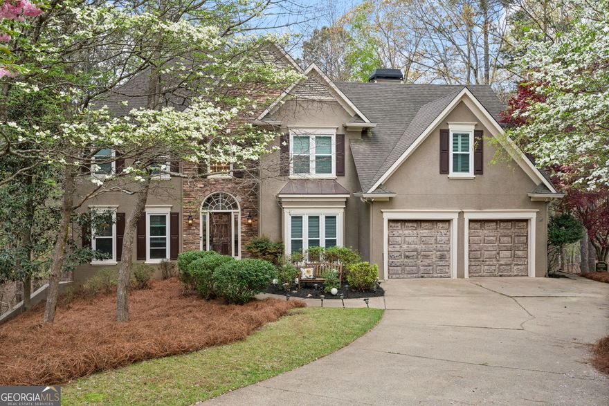 Here is your opportunity to own this stunning European executive style home with sophisticated elegance throughout in the sought after Eagle Watch subdivision, a Golf/Swim/Tennis community. Nestled in Eagle Watch on nearly an acre backing up to corps property, you will enjoy nature in your private oasis; you are approximately 700 feet to Lake Allatoona from the property line with seasonal views of the lake, availing you the opportunity for unlimited hiking and kayaking! Full deck with under decking is perfect for hours of rest and relaxation.  This home, the perfect blend of traditional, contemporary, and mountain design, will "WOW" you from the moment you enter the welcoming two story foyer leading to the formal parlor, formal dining room and kitchen - opening up to a custom mountain sunroom. This 3 to 4 season retreat seamlessly integrates the indoors with the outdoors and has Porch 365 custom adjustable windows and door, heating and air conditioning, built-in electric fireplace and overlooks your stunning backyard view, making  you feel like you are living in the mountains all year round. This home has had meticulous attention to detail in its transformation that will amaze you.  Chef's delight kitchen has been redesigned, updated and upgraded with outstanding features from the imported Turkish tile backsplash with brass inlaid, smart appliances, walk-in pantry, soft close doors, upscale hardware, pull out shelves, multi-temperature overhead lighting and so much more. Quartz countertops top the abundant countertop area. You have to see this kitchen to believe.  See the oversized family room with vaulted ceiling and built- in cabinets, gas starter fireplace and remote control solar shades. Breathtaking views of natural beauty become part of the room. Hardwood flooring on all of main levels. Stunning full bathroom and full bedroom on the main level makes the perfect office or guest suite.  Exquisite primary bedroom is a real retreat and has a double sided fireplace, small refrigerator and wine rack, walk-in closet, and a wall of windows with a spectacular view of your wooded backyard and beyond.  The room is large enough to accommodate a sitting area and work space.  The primary bathroom has abundant luxuries: heated floors, cove radiant heater, fireplace, new custom cabinetry vanities with soft close drawers, double vanity with quartz counter tops, double spa hot tub, towel warming rack, and smart Alexa connected bath fan, just to name a few. The large laundry room has a front loading washer and dryer and a collapsible folding table.  In this 5 bedroom -  5 full-bath home, each bedroom tells a story and its own full bath ensuring personal space and privacy for family and guests. All 5 baths have too many features to list but you must see to believe. Heated towel racks, fireplaces, rain showers and smart bath fans are among the features.  The terrace level has all new vinyl plank flooring and is designed for leisure and entertainment, so much to offer from the custom bar with epoxy surface, custom cabinetry and shelving, bar refrigerator in addition to full-size refrigerator, electric wall fireplace, custom bar lighting, wine cellar, and television/living area.  The wellness room with rubberized flooring is the perfect spot for fitness and privacy.  Also on terrace level is a full bedroom with a spacious full bath. Bedroom would make the perfect office, library, in-law suite. Also easily accessible is a spacious storage room. Don't miss the private custom screened-in porch that overlooks your fence backyard oasis and leads to the outside patio with spectacular views.  This home offers privacy, sophistication and an eye for detail with many special features and is a smart home. It has two hot water heaters, 5 refrigerators (3 full size and two mini's), on a quiet cul-de-sac of just 5 homes, new flagstone on front porch and sidewalk to wood plank stairway and partial new stone driveway.  Most windows are new and under warranty.