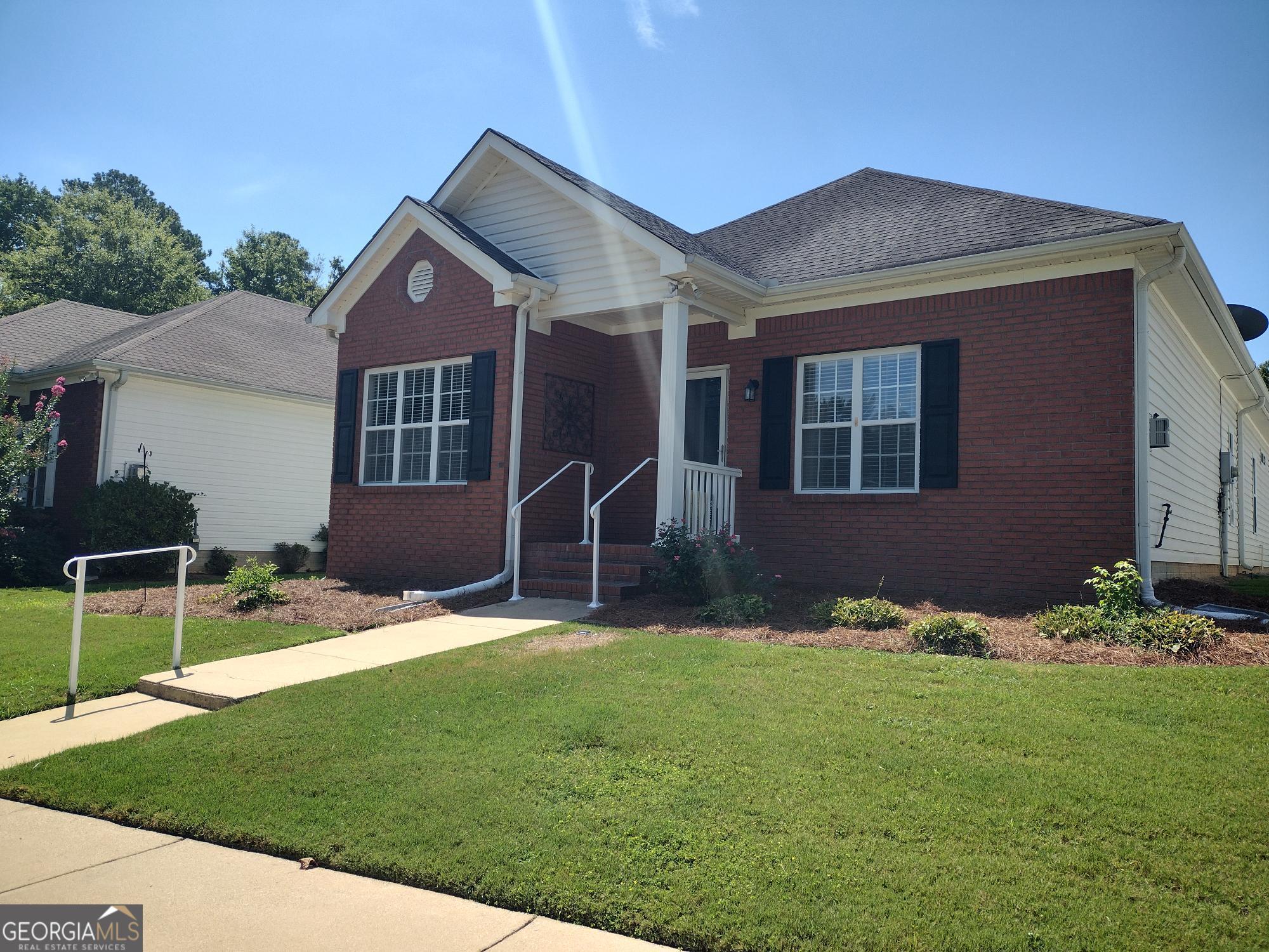 Embrace the ease of retirement living nestled within this 55+ community, just minutes away from Fayetteville City Center, County Complex, Dining, Shopping, Schools, Amphitheater, Senior Center, Hospital, Doctors, Peachtree City, The Town of Trilith, and Atlanta Airport. This one-level ranch home offers two bedrooms, two baths, a large living/great room, bright kitchen with eating area. A den/office/flex room, laundry room and attached garage. The main open area of the house lends itself to hosting gatherings, with the privacy of the bedrooms in the back. Primary bedroom is large enough to have an additional sitting/office/flex space and offers two walk-in closets, one large enough to hold your all-season clothes. The primary bath has a separate water closet, double vanity, with a walk-in shower. (primary bedroom is currently being used as a sewing room), Secondary bedroom is bright with a generous closet. Laundry in the hall is convenient to both bedrooms. Enjoy the rear alley where you can drive right into your garage. Don't miss out on this opportunity and start enjoying your easy living lifestyle.