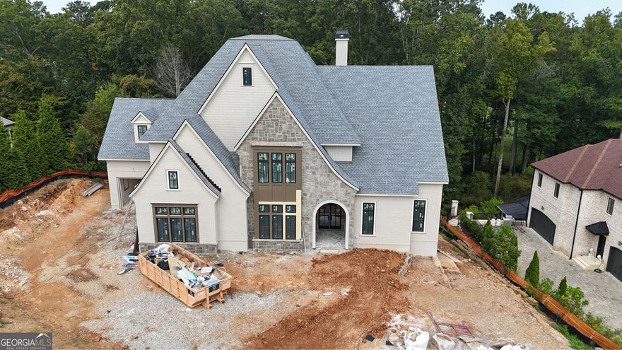 NEW CONSTRUCTION/INDOOR SPORTS COURT! Don't Miss This Incredible Estate Opportunity to Own Your New home on a 1 acre lot with golf course views in the prestigious gated Manor Golf and Country Club and award-winning Milton School system.  The Manor Golf Country Club offers indoor and outdoor pools, indoor and outdoor sports courts, basketball court, multiple restaurants, gym, spa, golf shop and more so you can appreciate resort styled living at its best!
