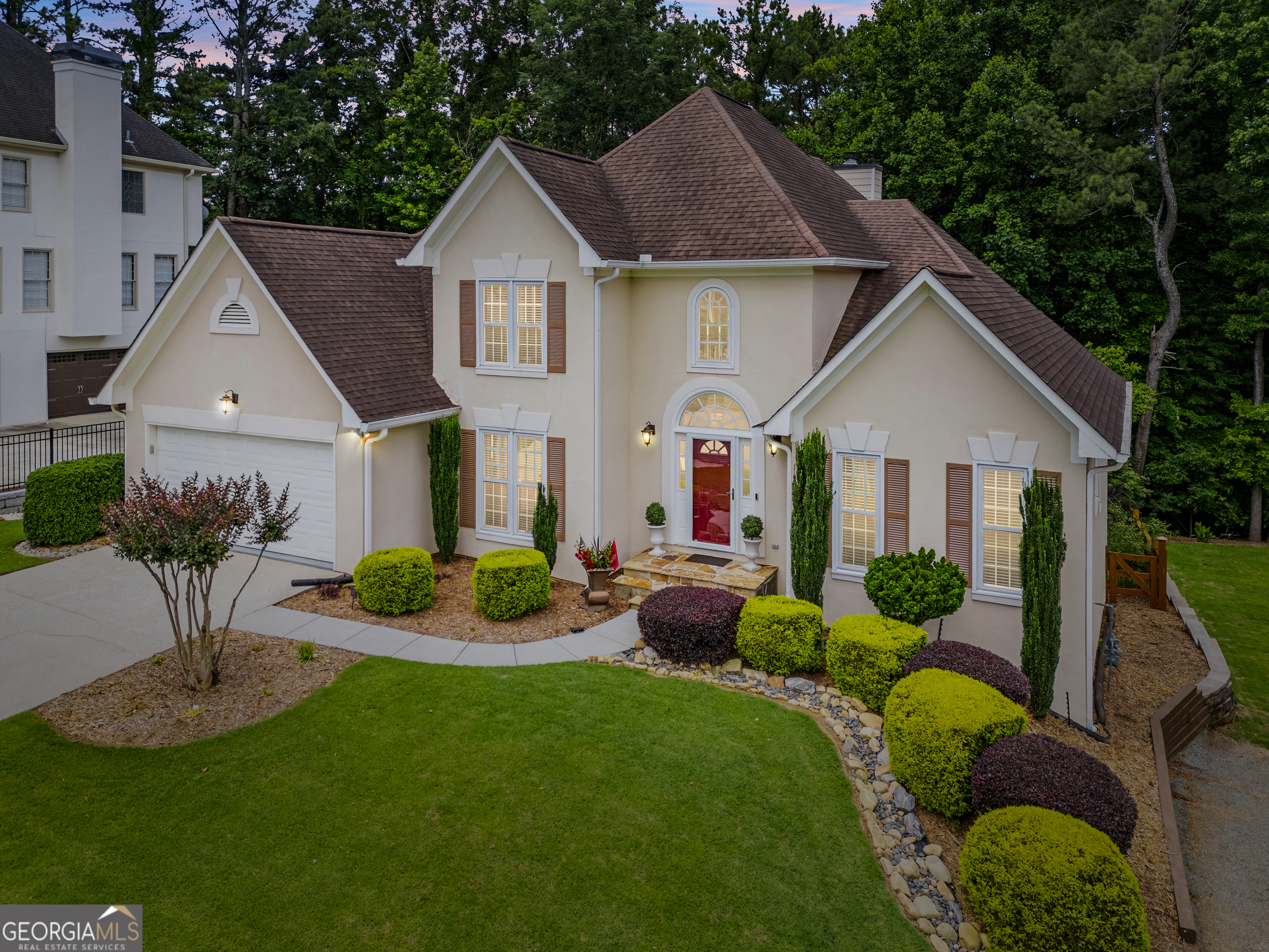 Luxury living awaits in this meticulously maintained home-perfect for the discerning buyer with impeccable taste. 3-Bed, 2.5-Bath Home with Primary on Main, Finished Basement & Award-Winning Curb Appeal. Welcome to this beautifully maintained home in the highly sought-after Medlock Bridge community, ideally located in the heart of Johns Creek/Alpharetta. Offering 3 bedrooms, 2.5 bathrooms, and a finished basement, this home blends comfort, style, and functionality-perfect for modern living. The main-level primary suite offers convenience and privacy, while the light-filled living spaces flow seamlessly for everyday living or entertaining. One of the home's standout features is the custom-built 425 sq. ft. cedar screened-in porch-a serene, all-seasons retreat that brings the outdoors in while providing shelter from the elements. Freshly painted exterior siding on the back and side adds to the home's already impressive curb appeal. Low-E double-pane windows with a limited lifetime transferable warranty enhance both energy efficiency and peace of mind. The meticulously landscaped yard has been awarded the "Yard of Excellence" by the Medlock Bridge HOA three years in a row-a true testament to pride of ownership. The finished terrace offers versatile living space with the potential to add a bathroom and create up to two additional bedrooms, a home office, media room, or flex space to suit your needs. Additional highlights include a fenced backyard, built-in closet and garage storage systems for organized and ample storage, a home security system, and professional landscaping that enhances the home's curb appeal. Enjoy gleaming hardwood floors, a stunning all-season cedar-covered porch, a dedicated grilling deck, and an inviting under-deck outdoor living area off the terrace level-perfect for relaxing or entertaining year-round. Community Amenities Include: Two clubhouses Two junior Olympic swimming pools Youth and adult swim teams Tennis and pickleball courts Active tennis leagues Holiday-themed events and HOA-sponsored activities Medlock Bridge is more than a neighborhood-it's a vibrant, active lifestyle in a top-tier school district and close to top shopping, dining, and entertainment. Don't miss your chance to own this thoughtfully updated home full of charm, character, and community spirit. Schedule your private showing today!