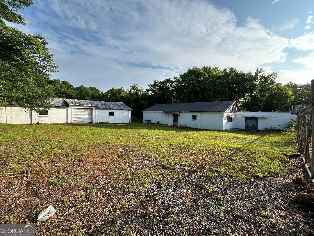 Two buildings on an acre of commercial property that would adapt to your business venture. Possible OWNER Financing with 30% down.