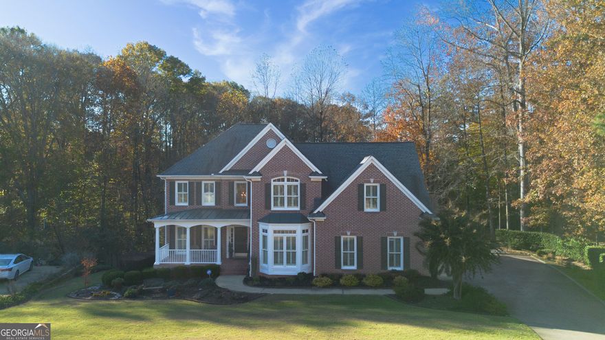 Situated on a serene cul-de-sac street within Woodmont Golf and Country Club, this unique 4-bedroom, 3.5-bathroom, 1.2-acre property exudes an unparalleled sense of privacy. Surrounded by wooded views and a tranquil creek just beyond the backyard, it offers a peaceful retreat. With only eight homes on the street, this rare gem is a true find in one of Cherokee County's most sought-after neighborhoods. Inside, the home has been beautifully updated with refinished hardwoods, a renovated kitchen featuring granite countertops, double ovens, a gas range, and an upgraded dishwasher. A bright sunroom overlooks the private backyard, while the newly designed patio, walkway, and firepit make outdoor living effortless. Thoughtful upgrades continue throughout the home with redesigned bathrooms, new windows, modernized systems, and lifetime transferable warranties on the AC units. A sprinkler system, sodded backyard, and Sentricon Termite bond ensure peace of mind for years to come. The unfinished basement, offers ample space for the imagination of any fortunate buyer who acquires this home. The community here is exceptional friendly neighbors, beautiful surroundings, and the option to join the private club for golf, swimming, tennis, and social amenities. Whether you prefer socializing or living in solitude, this community offers something for every homeowner. 402 Wilshire Lane perfectly balances privacy, quality, and connection a truly special home in Canton.