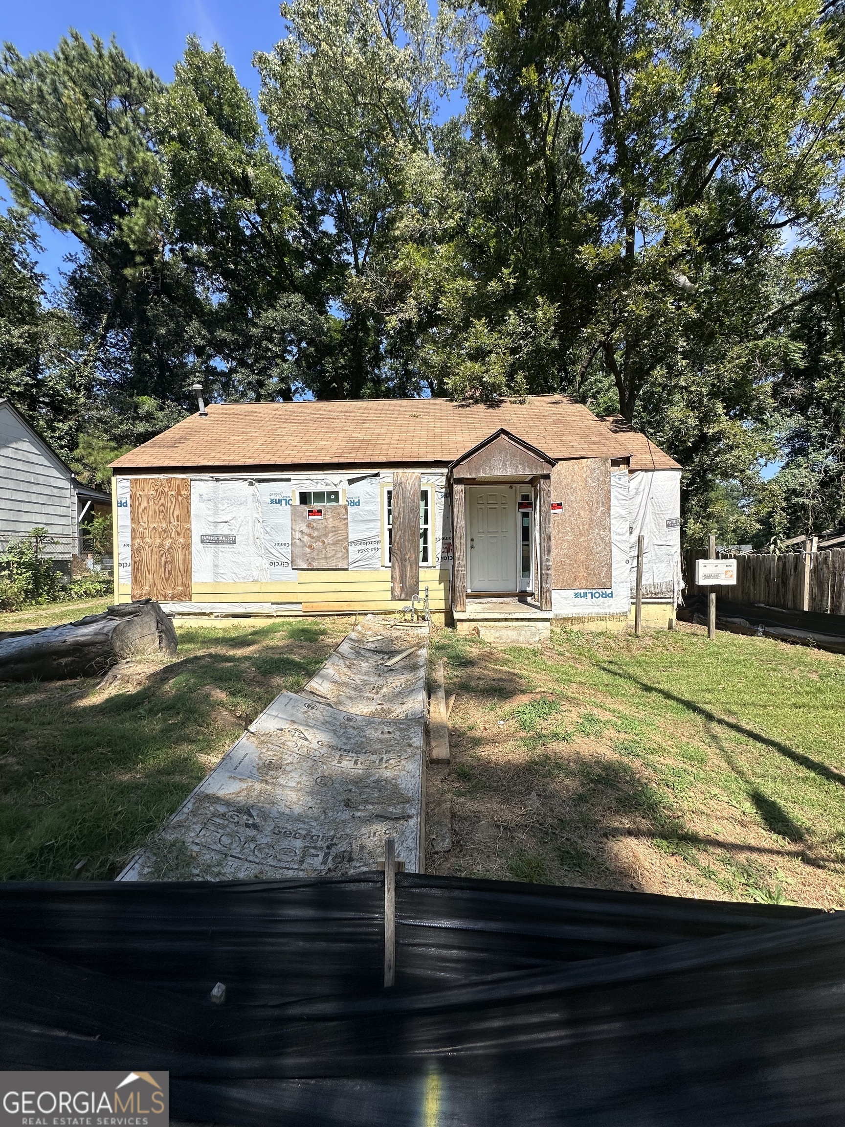 Seize the chance to transform this 3-bedroom, 2-bathroom gem at 1285 Campbellton Rd SW, Atlanta, GA into a lucrative investment or stunning new build! Fully gutted and cleaned, this property offers a blank canvas with exposed wooden framing and a striking exposed brick fireplace as the centerpiece, ready for your creative vision. Previously approved for an addition to increase square footage, this home is a dream project for house flippers or developers looking to maximize potential. The spacious interior features a versatile layout with high ceilings and abundant natural light pouring through existing windows, perfect for reimagining into a modern residence or profitable rental. Outside, the property boasts a generous lot surrounded by mature trees, with a welcoming walkway leading to the front entrance, adding curb appeal to the future renovation. Located in the vibrant heart of downtown Atlanta, you're steps away from top dining, entertainment, and major transit hubs, ensuring high demand from future buyers or tenants. This investor-ready property is primed for renovation to unlock its full beauty and value. Don't miss this rare opportunity to create something extraordinary in one of Atlanta's most dynamic areas-schedule a viewing today and bring your vision to life! Contact for pricing and details.