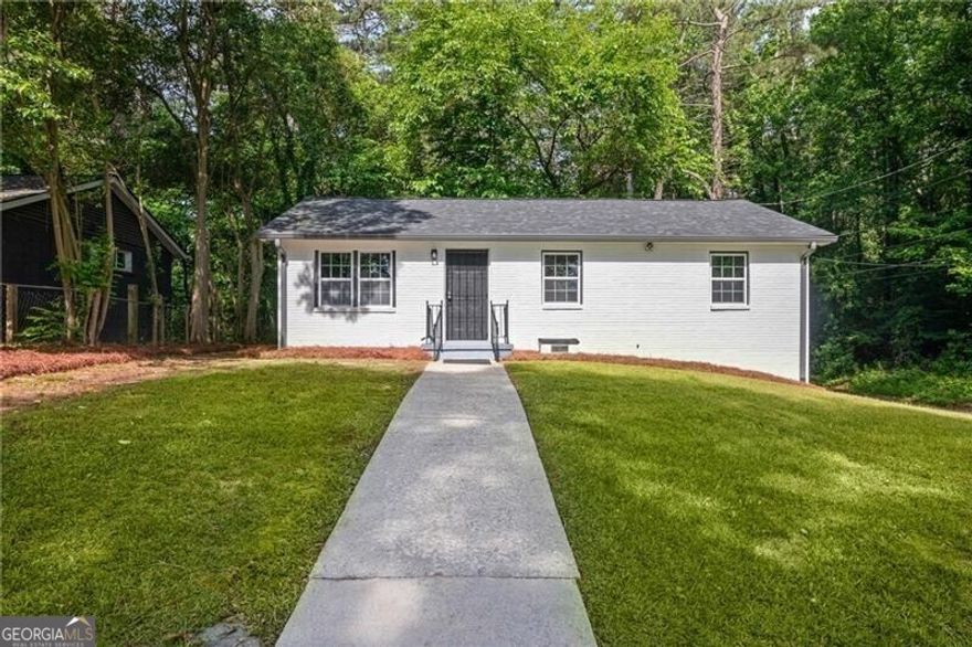 Beautifully renovated 4 sides Brick home has 3 bedrooms and a 1 and 1/2 baths.  Everything is new.  New Roof, New HVAC, New cabinets, New counters, New flooring, New lighting....Everything!!! New kitchen has shaker cabinets and opens to the family room. Perfect for entertaining. Real hardwood floors throughout the house and ceramic tiles in both new bathrooms. Master on main. Beautiful corner lot with a one car carport.  Easy to expand & enclose to a two car garage or more or add an axillary home for guests.  This location puts you a stones throw from restaurants, the belt line, Tyler Perry Studios, Atlanta Hartsfield Airport, parks, the MARTA, and major highways this is a commuters dream location. **Step into a beautifully renovated haven, ready to become your dream home or a savvy investment!**