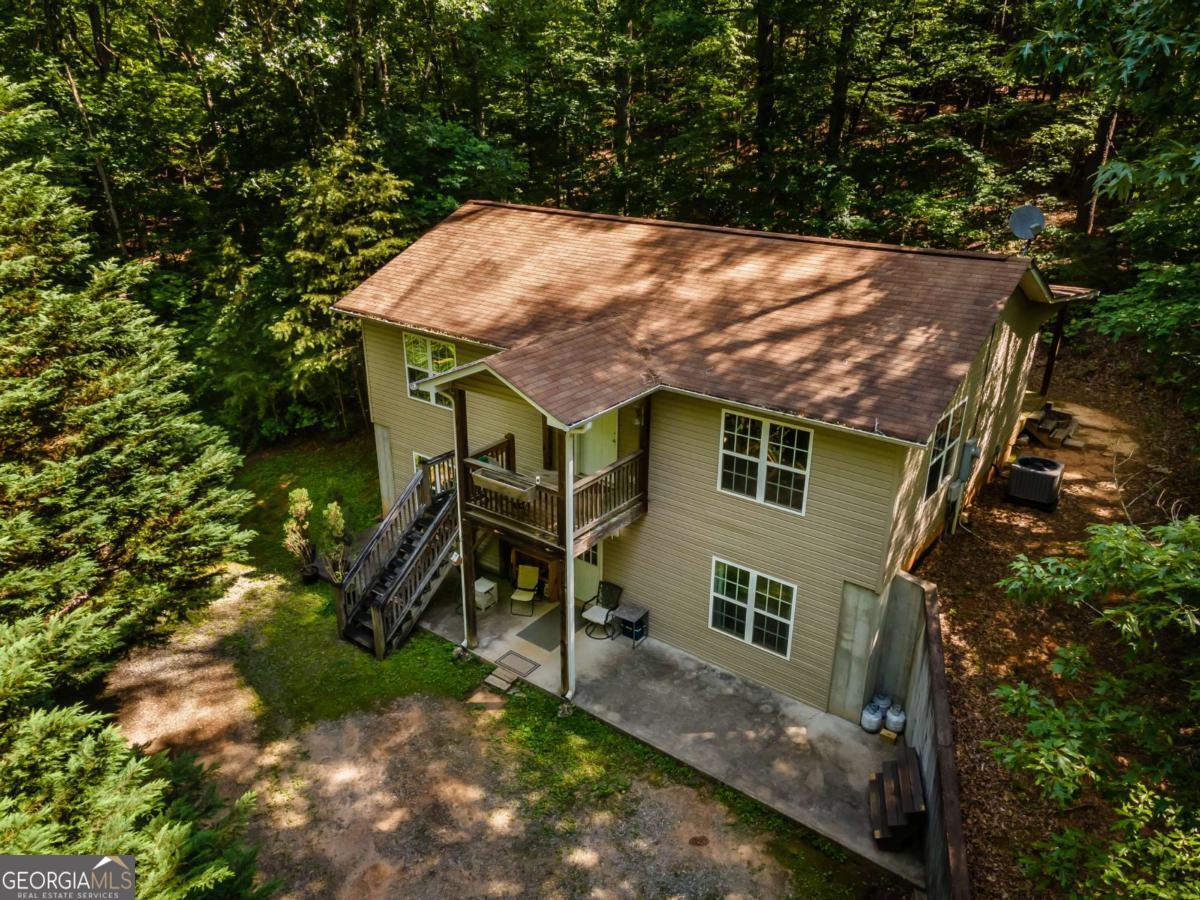 Welcome to your private family retreat, perfectly situated at the end of a quiet, private road. This spacious home offers plenty of room for the whole family, featuring 3 bedrooms and 3 full bathrooms. The main level includes a comfortable master suite with its own bathroom, as well as a guest bedroom and full bath. Soaring vaulted ceilings in the living room and kitchen create an open, airy atmosphere-ideal for entertaining and everyday living. Downstairs, the walk-out basement with a private entrance provides additional living space, including an oversized bedroom, a full bathroom, and a large laundry room. The opposite side of the basement offers endless possibilities-whether you envision a media room, game room, second living area, or a versatile bonus space, the choice is yours. This home combines comfort, privacy, and flexibility to fit your family's lifestyle.