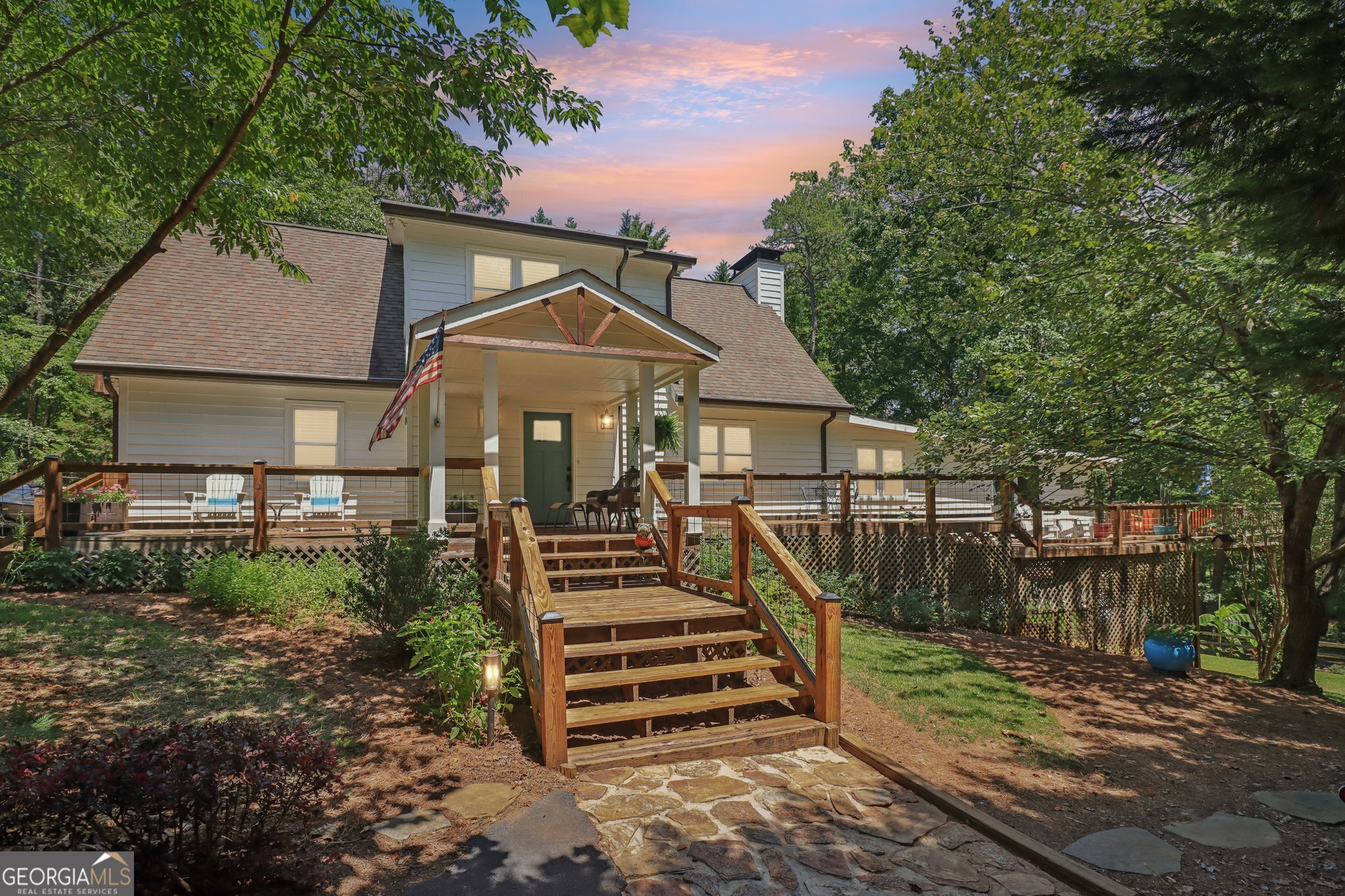 COMPLETELY RENOVATED LAKEFRONT RETREAT ON LAKE LANIER! Discover this beautifully updated 3-bedroom, 2.5-bath home nestled in a quiet no-wake cove on Lake Lanier in sought-after Dawson County. Enjoy peaceful lake living with a flat walk to the water-no stairs or steep slopes here! The property features a private dock, ideal for boating, swimming, and relaxing on the water. Inside, the home has been completely renovated with modern finishes, an open-concept layout, and plenty of natural light. ALL NEW - Windows, Roof, Gutters, HVAC System, Water Heater, Doors, Added Covered Grill Deck and 16x32 Deck - AND so much more (see upgrade list). Sellers OWN their DOCK and installed 62 tons of granite Rip Rap, covering 92 feet of shoreline. Home interior features Two bedrooms on the main and an oversized BONUS room provide ample space for permanent living or an extended stay for several guests. The Primary Suite offers its own cozy Balcony. GOURMET Kitchen opens to the FAMILY Room and Dining Room that has wall-to-wall built in shelving for added storage. VIEWS of the WATER from all rooms! Dramatic architectural ceilings create a bright and open feel. Whether you are looking for full-time residence or a weekend escape, this lakefront gem offers the perfect blend and comfort. The HUGE area underneath the decks offer an unfinished space for storing lake toys and other gear, offering all the storage you need for lakefront living. Oversized parking pad ample for permanent residents and plenty of guests! Located just minutes from GA 400, the North Georgia Premium Outlets, Northeast GA Medical Center, Historic Dahlonega, and award-winning North Georgia wineries-this home offers the perfect blend of lakeside serenity and convenient access to shopping, dining, healthcare, and weekend adventures. DON'T MISS THIS ONE!!