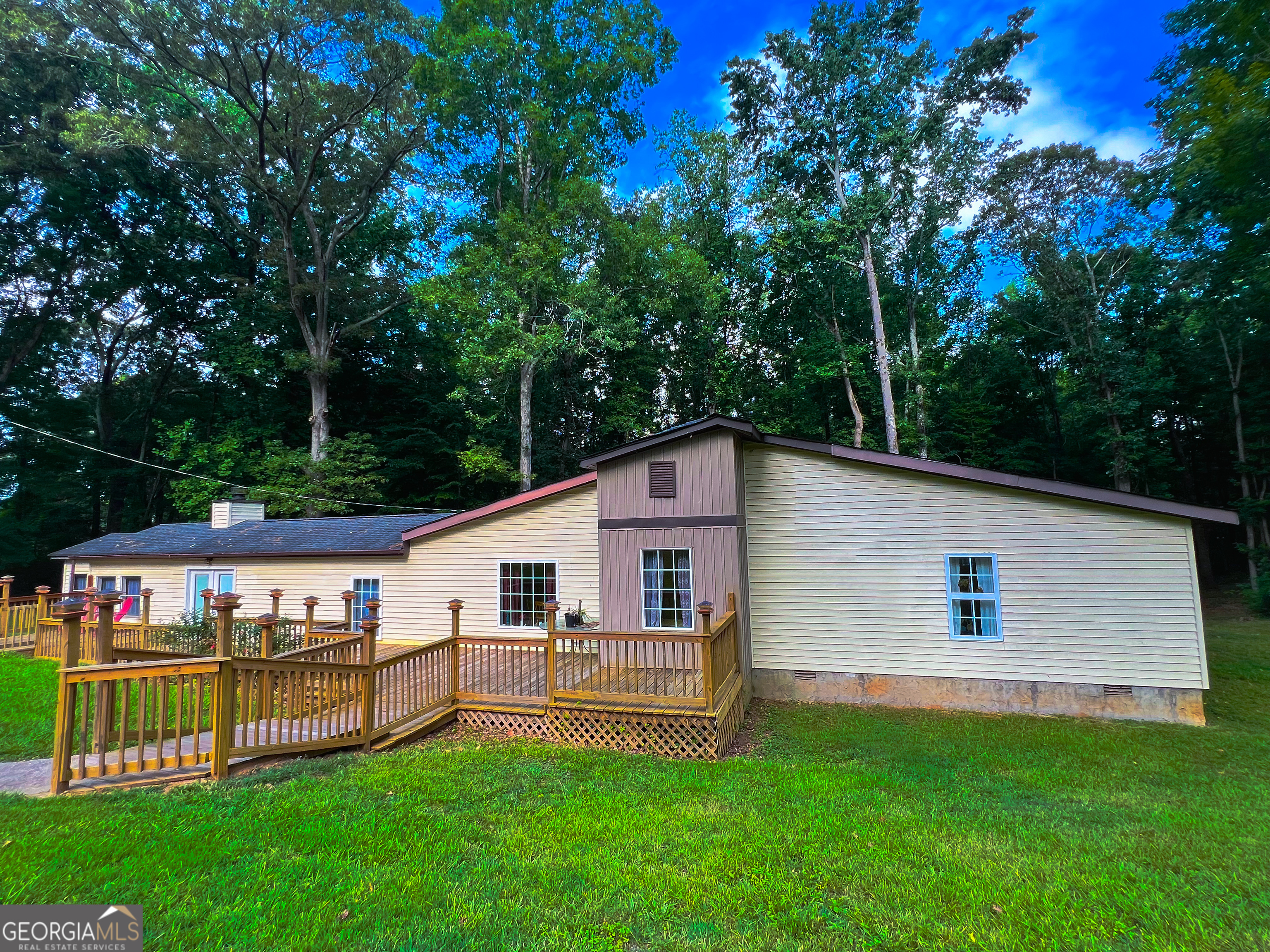 Motivated Seller / Priced to sell in the LOW $200's.  Rare and hard to find home on approximately 2.69 acres in Jefferson GA.  Clost to I85 off Hwy 129.  This home has 3 bedrooms and 2 bathrooms with working fireplace in the Great Room and a 4 seasons Sun Room.  Sold "AS IS".  Needs some updating.  Don't miss this one!  Will not last long.
