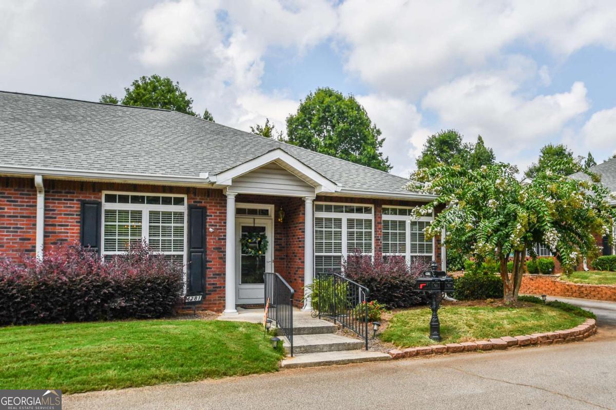 Welcome to this charming brick ranch in a quiet 55+ gated community. This true step-less home is filled with natural light and offers easy, single-level living. The spacious great room features beautiful hardwood floors, while the 2 bedrooms and 2 full baths provide comfort and convenience. There are also 2 flex rooms that can be used for office space or a quiet sitting room. You'll love the generous storage throughout the home and the low-maintenance lifestyle this small community provides. Residents here enjoy wonderful activities, including game night, potluck dinners, and various study clubs-creating a warm, social atmosphere. Move-in ready and designed with comfort in mind-don't miss it!