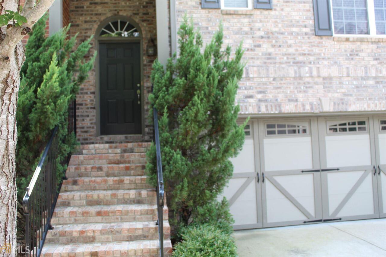Excellent location, gorgeous all brick townhouse located in Windward / Technology Corridor. Spacious end unit with all the upgrades including hardwood flooring throughout the main level, stairs & hallway. The kitchen features a pass through to the living room and a breakfast bar with granite counter-tops, s/s appliance and walk in pantry. Over-size master on 2nd floor. Two car garage and laundry room on upper level. New carpet in all bedrooms, interior walls and trim freshly painted. Townhouse is located in gated community, this is a must see.