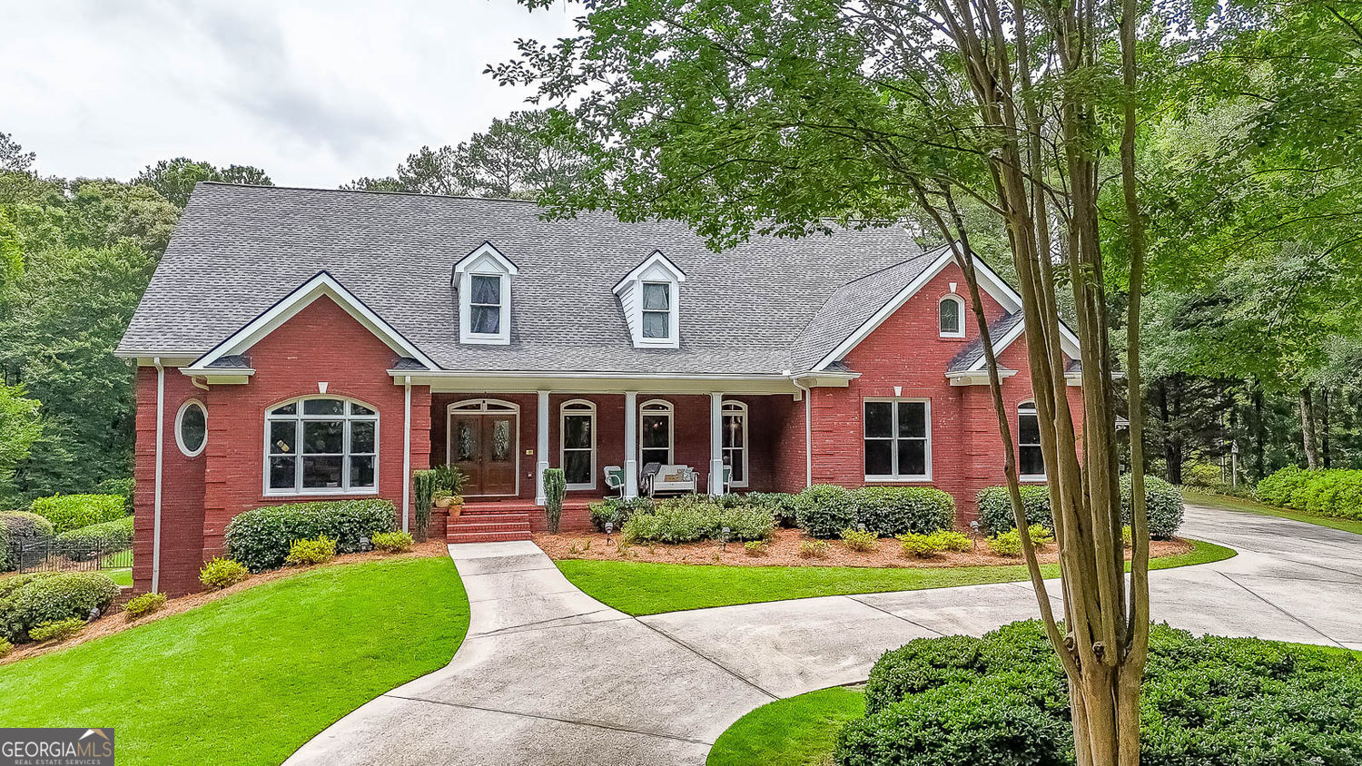 You can have it all! An Exquisite 7.27 Acre Private and Secluded Gated Estate located just 30 minutes from Downtown Atlanta and Minutes to Shopping and Dining. This home is an Entertainers Paradise! Perfect for Multi Generational Living, This Immaculate Stunner is Truly two Homes in One! Main Level Boasts Enormous Great Room with Bookcases and Fireplace, Separate Dining, Office, Impressive Kitchen includes Walk in Pantry, Wall oven AND Range, Icemaker and Vaulted Keeping Room with Fireplace. Owners Suite With Spa Style bath with Separate Vanities, Soaking Tub and Enormous Shower, Two Walk in Closets with Closet Storage Systems and Separate Sitting/Sunroom. Upper Level includes Bedroom Suite with Living Area, Full Bath, and Walk in Closet and Two Walk in attic Storage Area's. The IMPRESSIVE Terrace Level Offers an Open Concept Living/Dining/Pool Table Room, Exercise Room, FULL KITCHEN, Second Laundry Room, Two Bedroom Suites (Each with a full Bath and Walk in Closets) Half Bath, Darts Room, and Unfinished Flex Space. Outdoor Living Spaces Include a Covered Front Porch, Gigantic Screened Porch and Deck off Main Level, and Covered Porch off Terrace Level. The Majestic Backyard has an Inviting Heated Salt Water Pebble Tec Pool/Spa. Pool even has Upgraded Technology which can be Controlled from Your Phone! Aside from the 3 car garage with the main house, the detached 3 car garage is heated and cooled and is perfect for your "Cool Cars"!!! In addition, a 4 bay "Barn" (25x50) for all your other toys or to use for a home business. Also included is the Covered Awning (24x50) For your Motorhome/Boat with a 50amp hookup. The list of upgrades is EXTENSIVE, Custom Trim, Hardwoods, Upgraded Appliances, Irrigation , Plantation Shutters, Professional Landscaping and MORE! You have to see to appreciate! NEW ROOF JUST INSTALLED MAY 2025!!!