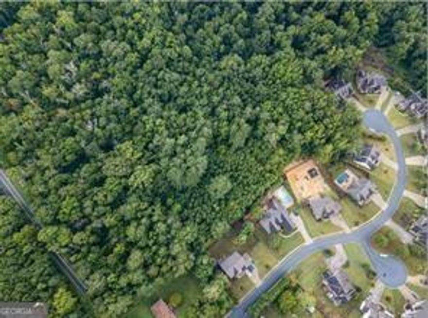 Looking for space and a great location! This LARGE BUILDABLE lot located in West Cobb is approximately 3 acres, partially wooded and private.  Just minutes from the Avenues Shopping Center.  Located near Serenity Estate Subdivision where homes start at 500K. You can Design and Build the perfect home here for you and your family.  This is a rare and prime piece of property in the area.