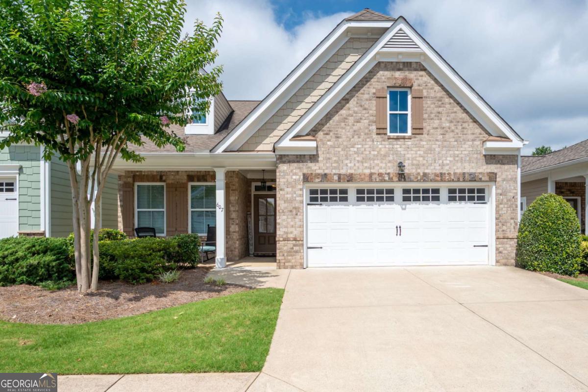 Welcome to 607 Abbey Road in beautiful Woodstock, GA! This move-in ready 3-bedroom, 3-full-bath home offers comfortable living with a bright, open layout and thoughtful design throughout. The spacious main level features a fireside living room, a well-appointed kitchen with ample cabinet space, and a dining area that flows seamlessly for easy entertaining. Retreat to the oversized primary suite with a private bath and generous closet space. Two additional bedrooms and full baths provide flexibility for guests, a home office, or multigenerational living. Enjoy peaceful mornings on the patio or take advantage of the neighborhoods fantastic amenities including a pool, clubhouse, and well-kept common areas. Located just minutes from downtown Woodstock, shopping, restaurants, and easy access to I-575. This home combines low-maintenance living with modern comfort in one of Cherokee County s most desirable communities. Schedule your showing today!