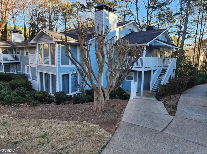 Nestled in a serene setting, this beautiful home is perfect for nature lovers.The 2 bedroom, 2 bath, modern condo has so much to offer. The chef's kitchen is a standout with ample cabinetry, a spacious island, a gas range, and sleek hard-surface countertops.  The sunroom offers versatile space, ideal for a home office or relaxation area. Step outside to a private deck that is perfect for entertaining! The community boasts amenities, including a pool, scenic walking trails, pet-friendly options, and plenty of parking available. The HOA fee covers water, sewer, trash pickup, exterior and community maintenance, and pool... ensuring hassle-free living! This prime location offers easy access to Truist Park and The Battery Atlanta for Braves games, the Chattahoochee River for scenic hikes, and top employers like Dobbins Air Reserve Base and Lockheed Martin. Kennesaw State University, Life University, and major highways including I-75 and I-285 are all within reach. Downtown Atlanta and Hartsfield-Jackson International Airport are also just a short drive away. Experience the perfect blend of privacy, modern updates, and unbeatable convenience,  your ideal home awaits