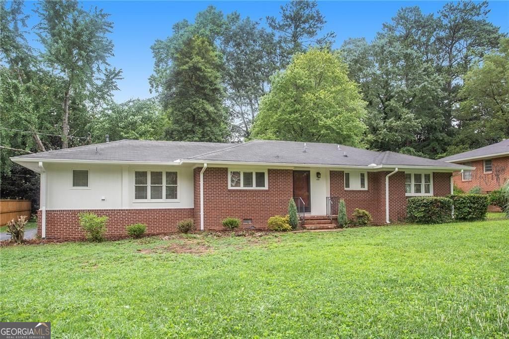 Fantastic 3/2 Classic 1957 Ranch in the highly sought after Historic Marietta area, West Side Elementary. Great deck and yard. Faces Polk Street, driveway access on Pamela St. makes for safe and easy ingress and egress. Beautiful hardwood floors, updated bathrooms, eat-in kitchen, laundry room with room for extra storage, covered parking for one car, driveway parking for two. Sidewalk all the way to Westside School, Marietta Middle School, and Downtown Marietta. Super convenient commute to I-75, East Cobb, West Cobb, Kennesaw Mountain National Park areas. A long history of happy tenants here in this charmer, lovingly dubbed by one of the originals, "The Polk Palace."