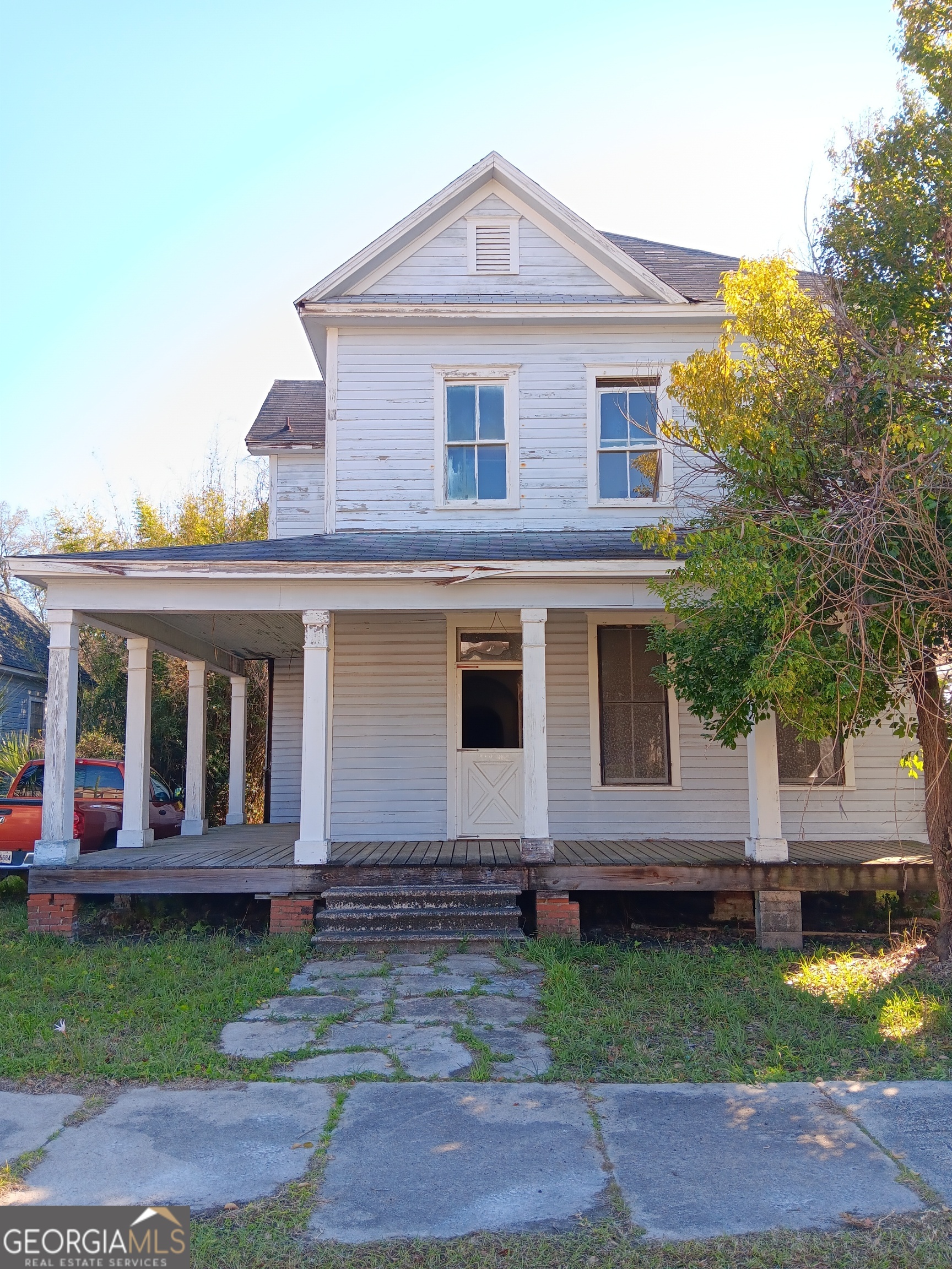 Step into history with this enchanting home from the 1900s, located just moments away from town and a beautiful park. This residence boasts towering 10-ft ceilings that add to its spacious and grand feel, making it a perfect blank canvas for your creative restoration. With a roof that's only 10 years old, it's ready for your vision to come to life. Whether you're an investor seeking a valuable project or a homeowner dreaming of crafting your ideal space, this property offers endless potential. Sold As-Is, it's a rare chance to blend historical charm with modern possibilities!
