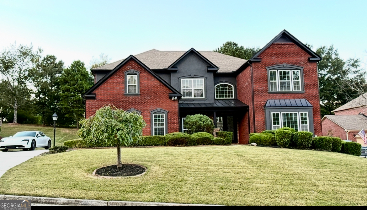 Welcome to this beautifully updated 5-bedroom, 4-bath home in the prestigious Estates at Southland, a premier golf, swim, and tennis community. Designed for modern living with timeless elegance, this 4-sided brick residence offers both style and functionality. Inside, discover new flooring throughout, a striking oak-and-metal staircase, and fresh paint inside and out. The chef's kitchen boasts brand-new KitchenAid stainless appliances, updated cabinetry, quartz countertops, and designer lighting. A versatile bedroom on the main level with full bath is perfect for in-laws or live-in help, while the upstairs hosts four additional bedrooms including a luxurious primary suite with a spa-like bath featuring a soaking tub, frameless glass shower, and expansive custom closet built-ins. Generous built-ins in the master closet and living areas add both storage and style. A bonus finished room off the garage makes an ideal home office or gym. Additional upgrades include a new Navien tankless water heater and fully updated bathrooms with custom vanities. Outside, enjoy the serene setting of a golf course community just minutes from Stone Mountain Park. Move-in ready and fully remodeled, this home is the perfect blend of luxury, comfort, and convenience.