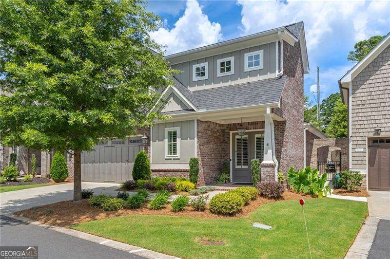 PRICED BELOW MARKET VALUE!! Stunning Craftsman-Style Home Built in 2021 - Primary Suite on Main & Low-Maintenance Living!Welcome to this meticulously maintained, move-in-ready Craftsman-style home offering the perfect blend of elegance, functionality, and convenience. Built in 2021 with durable cement siding and brick, this home combines timeless beauty with lasting quality Step inside to discover an open, light-filled floor plan highlighted by gleaming hardwood floors and elegant plantation shutters throughout the main level. The spacious living area flows seamlessly into a gourmet kitchen that's a chef's dream-featuring quartz countertops, top-of-the-line stainless steel appliances, a gas cooktop with designer hood, an oversized island with upgraded fixtures, and abundant prep and storage space. The luxurious main-level primary suite provides a peaceful retreat, complete with a HUGE walk-in closet and a spa-inspired bath boasting dual vanities and a beautifully tiled designer shower. With three full bathrooms and one half bath, this home is designed for ultimate comfort and convenience. A thoughtfully finished, climate-controlled storage room adds exceptional versatility and additional functionality. Extend your living space outdoors with the private screened-in porch-perfect for year-round relaxation. Designed for a lock-and-go lifestyle, the HOA handles all landscaping, making this an ideal choice for travelers or anyone seeking low-maintenance living. Perfectly located off Hwy 92, enjoy easy access to Roswell, Woodstock, and East Cobb, with top-rated schools, dining, shopping, and lifestyle amenities just minutes away. Don't miss the opportunity to make this beautiful home yours!