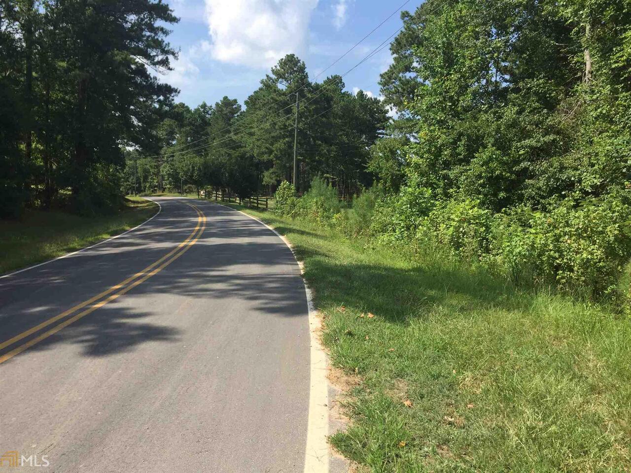 Country Living! 15.32 Acres of wooded land with a county approved driveway and frontage along 2 roads. County water is available along the road. Small stream flows through the middle of the property only a few miles of of Hwy 16 between Carrollton and Whitesburg.