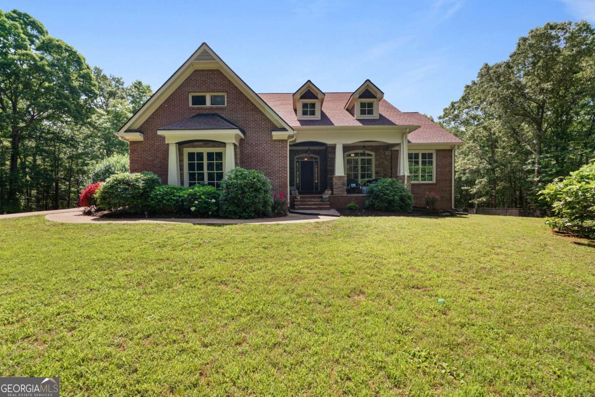 Experience unparalleled living at this captivating Kingston estate, a sprawling 4858 square foot home situated on a private 16.29-acre lot. This property provides the rare opportunity for quiet, expansive living with all the amenities of a resort. The residence features a natural, flowing layout with hardwood flooring and a neutral color scheme, allowing for effortless personalization. The main living space is defined by a striking stone fireplace that provides a cozy focal point and seamlessly connects to a modern kitchen. This culinary area is equipped with sleek countertops and ample cabinetry, designed for both functionality and style. The home offers five bedrooms and three full bathrooms, including a serene primary suite. The ensuite bathroom is a private retreat with a separate glass shower and a luxurious freestanding tub, ideal for unwinding. Each additional bedroom is generously sized to provide comfort and privacy. The outdoor features are the true highlight of this unique property. Beyond the home's doors lies a personal haven, complete with a large private swimming pool and a dedicated fire pit area, perfect for entertaining guests or simply enjoying the peaceful surroundings. A significant asset is the large barn, offering substantial storage for recreational vehicles, boats, or equipment. The 16.29 acres of grounds also provide endless possibilities for outdoor activities and exploration. This Kingston property combines a comfortable, well-designed home with a vast, private landscape, creating an ideal setting for both relaxation and recreation.