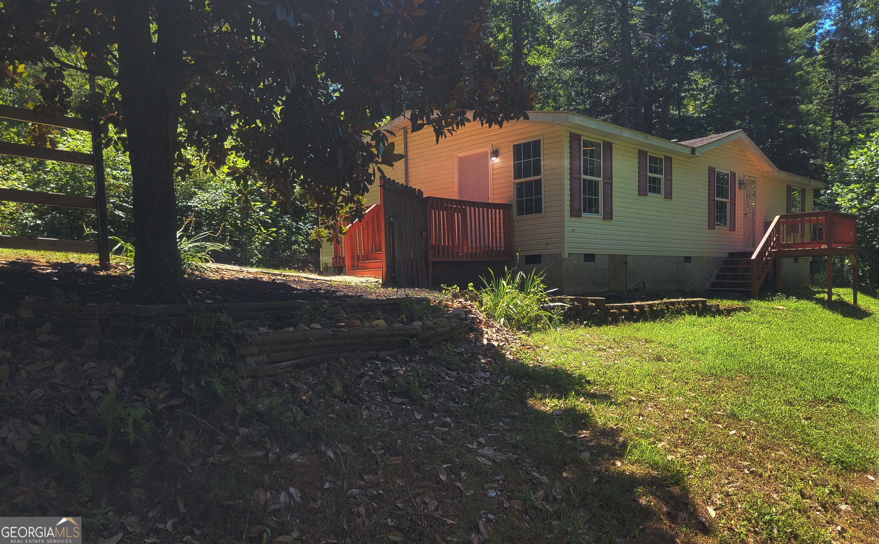 Have you ever dreamed of owning a home in the North GA mountains? Check out our Virtual Tour on the revolving home above! CRAZY LOW PRICE for this 1.2 acres of mountain solitude only 20 minutes from downtown Ellijay. NO DOWN PAYMENT REQUIRED on owner occupants with the USDA! MOVE IN FOR AS LITTLE AS $4500 TOTAL!!!..with a seller contribution toward closing costs. Perfect for your own second home mountain retreat! This 3 bdrm/2 bath cottage is 1344 sqft with treed views and sits on a partially fenced homesite with plenty of parking. Located only 20 minutes from the exploding Ellijay downtown shopping, dining and night life. The home is also located near 12 mountain area Wineries! Low maintenance LVP ENGINEERED FLOORING, has newer blinds, maintenance free siding and includes the washer/dryer/frig. The OPEN floorplan has a LARGE LIVING AREA with a cozy wood burning fireplace. The LARGE DECK is divided up into a sun-lit outdoor section and a SCREENED in area as well. New well pump means no water bill! Property taxes are only $303/per year at present! Tremendous Air BnB rental potential!