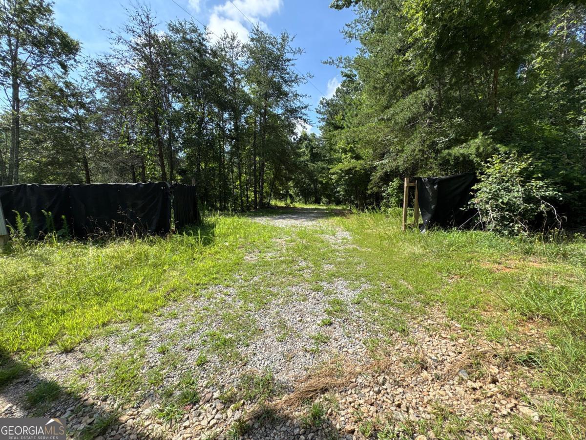 Discover the perfect canvas for your dream home on this stunning 2.1-acre lot at 1515 Hughes Drive in Cumming, GA. Tucked away on a quiet, scenic road, this buildable property offers the best of both worlds-peaceful privacy and easy access to top-rated schools, shopping, and Lake Lanier. With no HOA and plenty of usable space, you'll have the freedom to design exactly what you've envisioned. Walk the property and see the potential for yourself this is your chance to bring your vision to life.