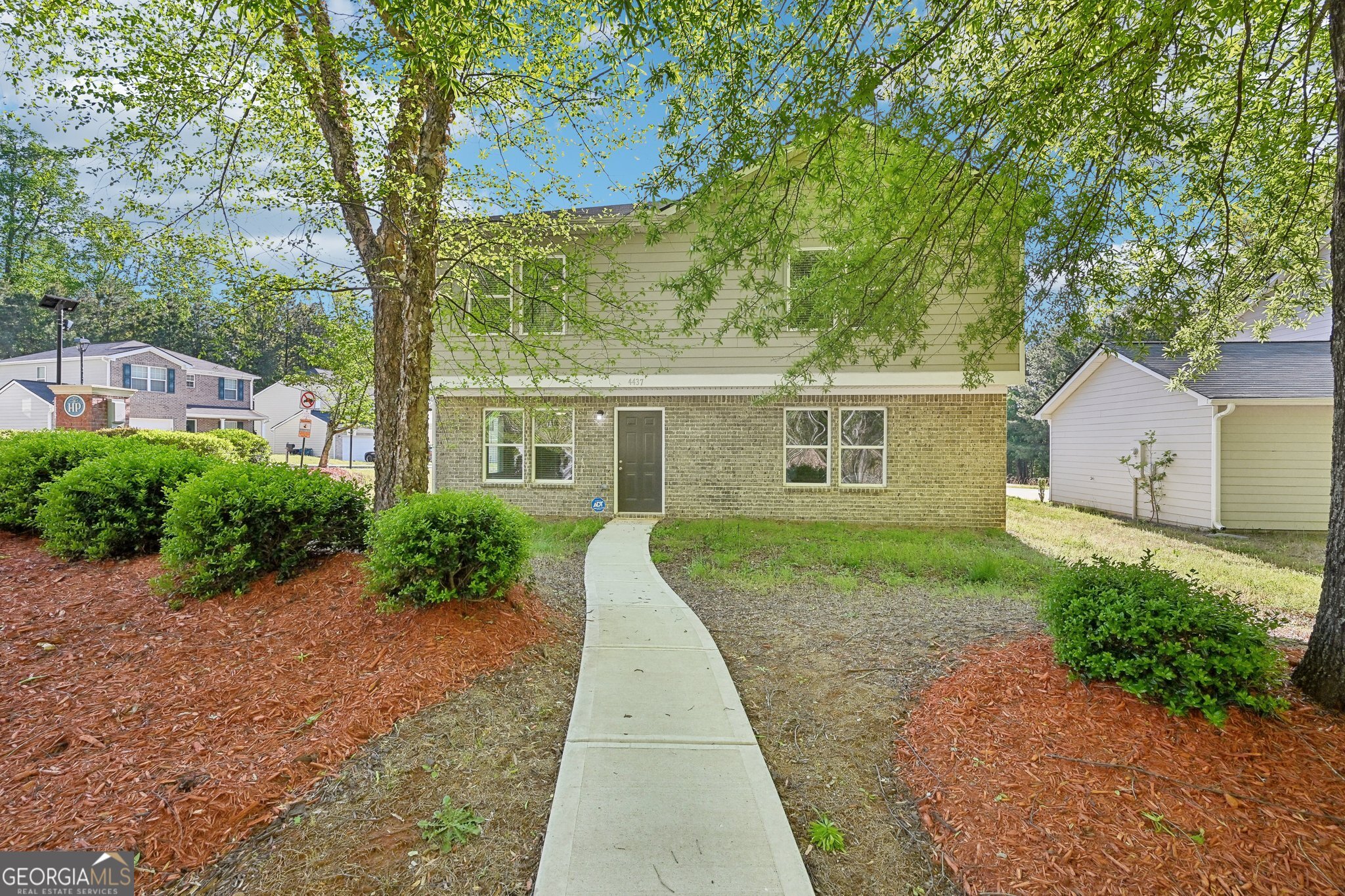 Welcome home to this like-new, 4 bedroom, 2.5 bath, 2-story home in sought-after Heritage Park in Atlanta. Situated on a large corner lot, this home offers a main level with an open concept floorplan. The kitchen features a breakfast area, crisp white cabinetry, granite countertops, pantry, LVP flooring, stainless steel appliances, and an unfettered view to the family room. The main level also includes a half bath and access to the attached two-car garage. Upstairs, you'll find a spacious primary suite with an en suite that includes double vanities, a tub/shower combo, a linen closet, and a large walk-in closet. The upper level also offers a second full bathroom and three additional bedrooms, one of which includes a walk-in closet. The home features an extra-large driveway that can fit three cars side by side, in addition to the two-car garage, perfect for multi-car households or entertaining guests. The property is surrounded by greenery with no neighbors on three sides, providing both privacy and scenic views. This home boasts advanced security features, including video cameras, motion sensors, a video monitoring system, and a video doorbell, offering peace of mind to residents. Additionally, the HOA has installed Flock Safety surveillance cameras throughout the neighborhood to enhance community security. Residents enjoy fantastic HOA amenities such as a swimming pool, playground, park areas, and lots of extra parking making the neighborhood both convenient and community-oriented. Conveniently located close to schools, dining, and shopping-this move-in ready property will not last long. Call to schedule your tour today!