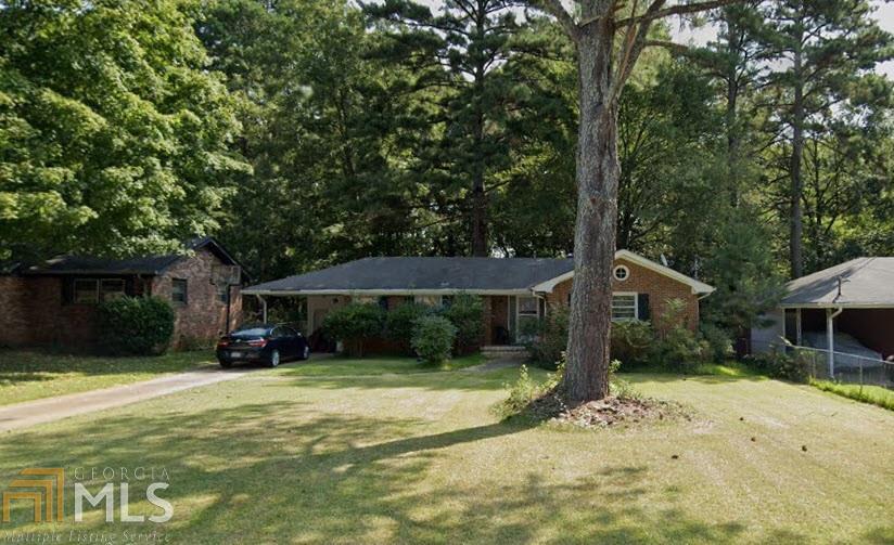 Investors get your permits and you're ready to remodel and no surprises when you open up the walls 'cause we've already done that for you! What you see is what you get, so easy to budget, crunch the numbers and you can make it work! Base your After Repair Value on what comps will be 3-6 months from now as prices continually rise in this hot 30032 market. Mid Century all brick 1-level gem. Great locations where prices are increasing fast so hurry and get in on this great opportunity. Close to downtown Decatur, Kirkwood, Avondale Estate & 2nd & Hosea. New mixed use on Covington Hwy with $350k townhouses in mixed use development. Hardwood floors, separate laundry room, huge storage unit in back, with 1 car carport. Easy access to interstates or plenty of shortcuts to Emory, Downtown Atlanta & Midtown. Sold As Is.