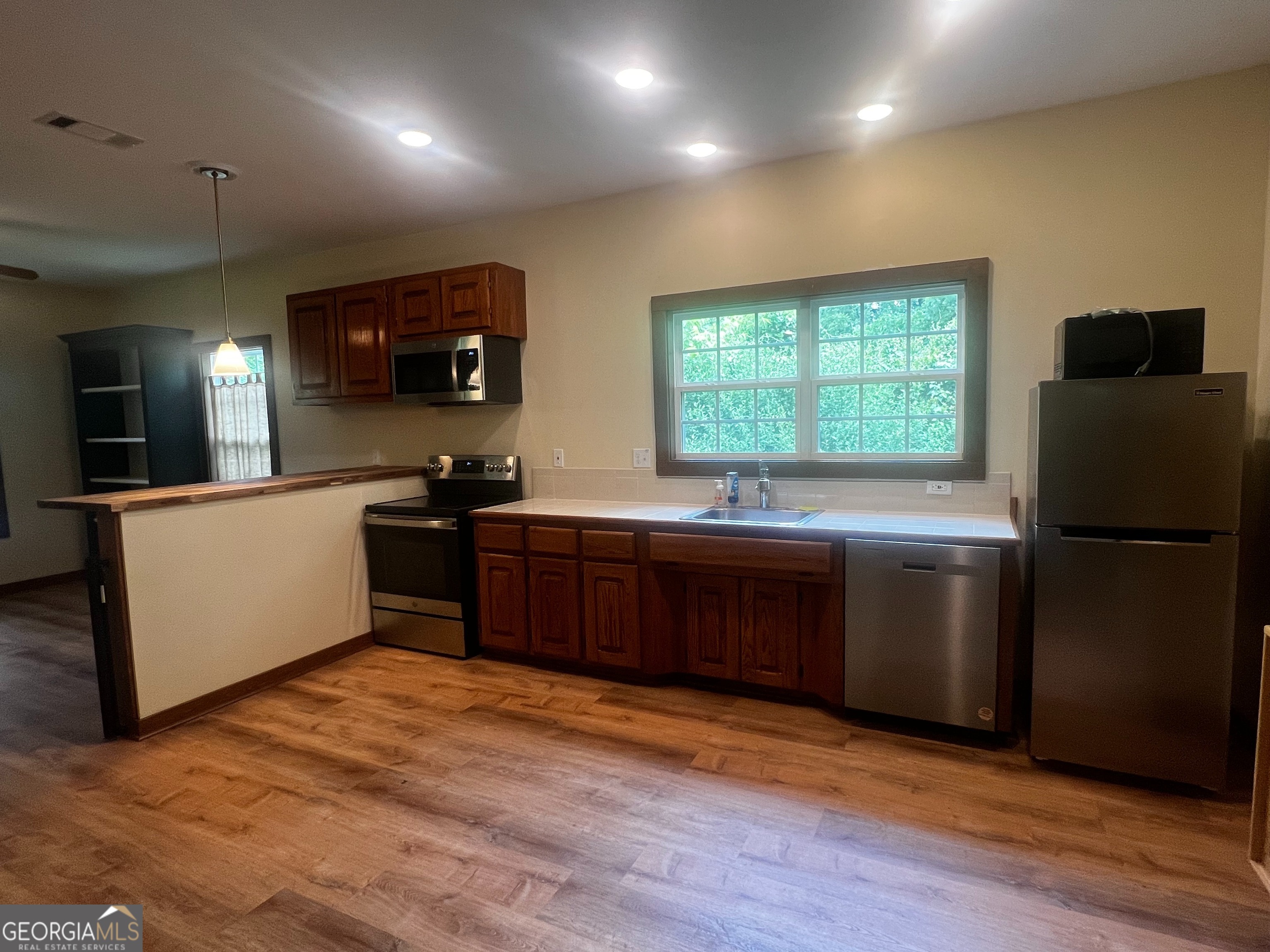 Welcome to 172 Brockton Road, Jefferson, GA 30549! This recently renovated 3-bedroom, 2-bathroom single-family home offers 1,200 sq. ft. of upgraded living space. Featuring new floors, vaulted ceilings, and an inviting rocking chair front porch, this home combines charm with modern updates. Inside, you'll enjoy a spacious layout with an office or sitting room just off the kitchen, perfect for working from home or relaxing. The property also boasts a covered patio for outdoor enjoyment and is fully fenced and gated, offering added privacy and security. Located close to local schools, shopping, and dining, this home provides both comfort and convenience. Schedule your tour today!