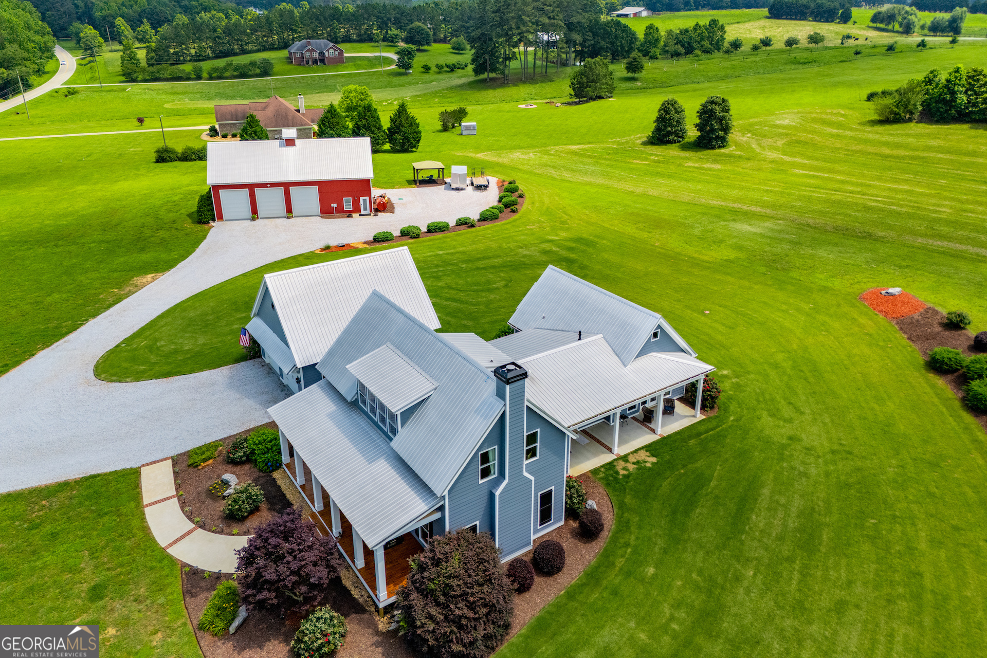 Welcome to 385 Liberty Church Rd - Carrollton, GA A truly one-of-a-kind Southern estate, this custom-built modern farmhouse pairs upscale living with unmatched functionality. Set on 5 beautifully landscaped acres just minutes from downtown Carrollton, this property offers the perfect balance of comfort, privacy, and versatility. Whether you're dreaming of wide front porches and quiet mornings or need a fully outfitted shop for your business, hobbies, or creative work-this place delivers. Just south of Carrollton and minutes from shopping, dining, medical care, and the University of West Georgia. Enjoy peace and space without losing convenience. 9 minutes to Adamson Square 6 minutes to Roopville Elementary 12 minutes to Central High School Easy access to Hwy 27 Schedule Your Private Showing This property is shown by appointment only with 24 hours' notice. Pets on site - must be secured prior to any showings. The Home 3 Bedrooms | 2.5 Bathrooms | 3,176 Heated Sq Ft Built in 2015 with thoughtful upgrades throughout. Vaulted ceiling owner's suite on the main level with a spa-like travertine bathroom, Jacuzzi air tub, wall-mounted TV, and California Closet system. Wide-open main living area with 3/4-inch white oak hardwood floors throughout. Custom French-country cabinetry in the kitchen and bathrooms. Separate dining, oversized great room, and breezeway connection to garage. 400-amp electrical service - already designed for a pool if desired. Dual HVAC systems: 2.5-ton A/C + 90% gas furnace on the main 2-ton heat pump upstairs 4-foot encapsulated crawlspace with dehumidifier - excellent for storage and comfort. Professionally landscaped exterior with a large front porch, covered rear porch, and side patio. Attached oversized 2-car garage with attic storage above. The Barn / Workshop 60 40 ft Structure | 3,360 Total Heated Sq Ft Built for function but finished with comfort and detail in mind. This is more than just a barn. Shop Area - 1,936 sq ft Four 1012 ft roll-up doors (two motorized with remotes) Epoxy-coated concrete floors 200-amp service 5HP / 60-gallon air compressor piped to all bays Plywood-finished walls with custom shelving and tool hangers Dedicated 2-ton heat pump + insulation throughout for year-round comfort Finished Living Area - 1424 sq ft Private office, full kitchen, full bathroom, laundry room, and a bonus rec room upstairs Separate 2.5-ton heat pump system LVP flooring throughout Connected to its own 1,500-gallon septic tank This space is ideal for: A home-based business Car collection or mechanical work Studio, gym, or creative space The Land 5.00 Acres - Private, Level, and Useable Professionally landscaped but low-maintenance Large driveway and ample room for guest or trailer parking Tons of space to add a pool, garden, fencing, or additional outbuildings No HOA or restrictions Zoned for highly rated Roopville Elementary and Central Middle/High School 1,500gal septic tanks serve house & barn independently. WHY YOU'LL LOVE IT Estate privacy without isolation- 10 min to shopping, dining, Tanner Medical & UWG. Roopville Elementary / Central Middle & High schools. Highspeed internet available for seamless workfromhome. 24hour showing notice-pets on site. Where modern comfort, artisan finishes and unmatched workspace meet-come see why 385 Liberty Church Road is Carroll County's most versatile milliondollar opportunity. Schedule your private tour today!