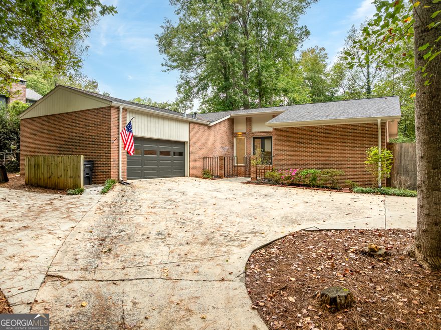 This 4-sided brick ranch was completely rebuilt in 2018 and is better than new. Featuring an open floor plan, quartz countertops, custom cabinetry, farmhouse sink, stainless appliances, and a floating hood over the gas range, the kitchen is a dream. Spacious bedrooms and spa-like baths with frameless glass showers and custom vanities make this home shine. Updates include newer roof, AC, vinyl windows, spray foam insulation, and encapsulated crawlspace. Step outside to your private fenced oasis with year-round landscaping, a 4-seasons room, and powered workshop, all in a beautiful neighborhood with no HOA, top-rated schools, and just minutes from downtown Kennesaw, Acworth, and Marietta. Don't wait-this one won't last!